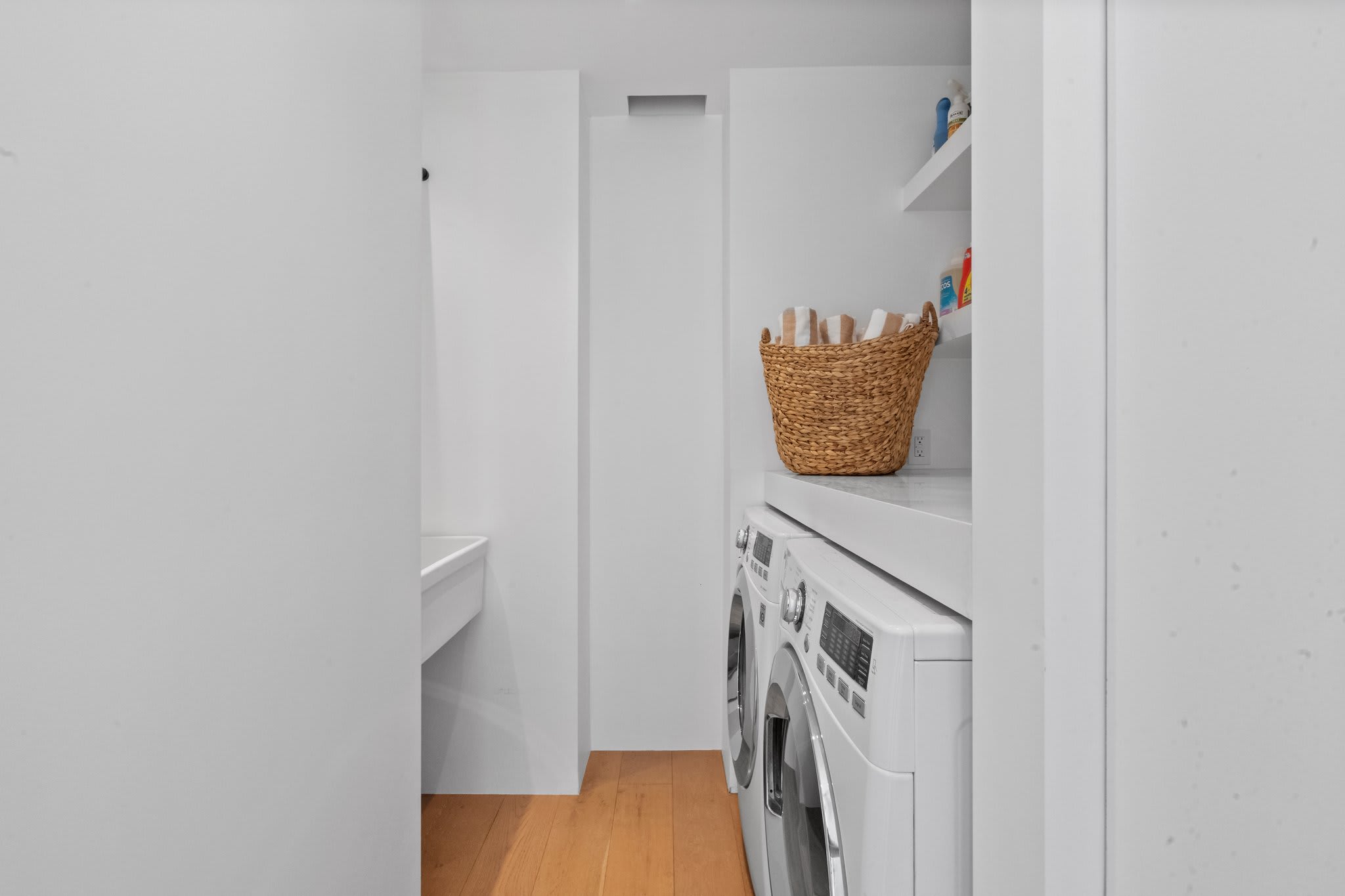 A dedicated laundry space with premium appliances and thoughtful storage.
