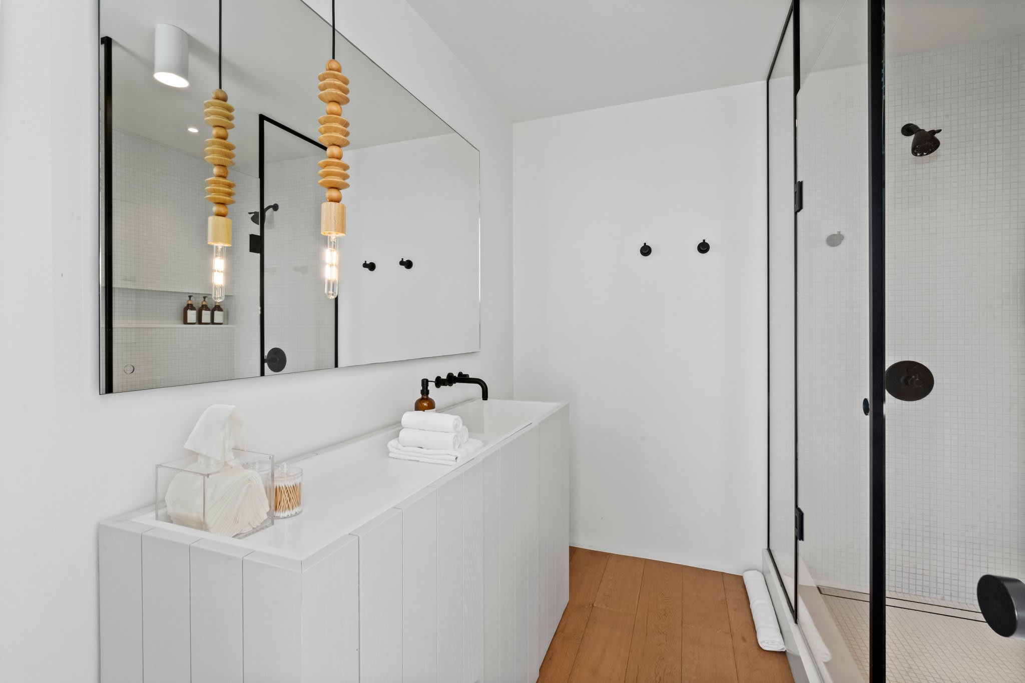 Thoughtful details, from sleek black fixtures to soft, ambient lighting.