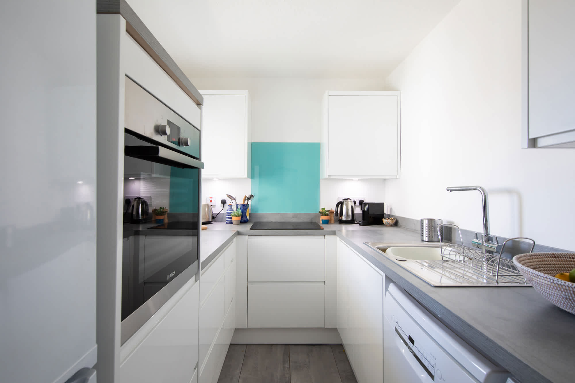 Every inch of space is well-used to provide you with this modern, fully equipped kitchen