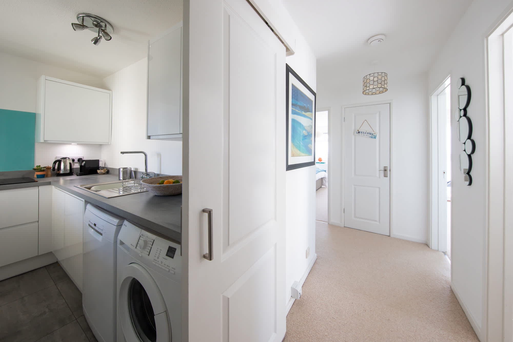 Spacious hallway connects all rooms of the apartment