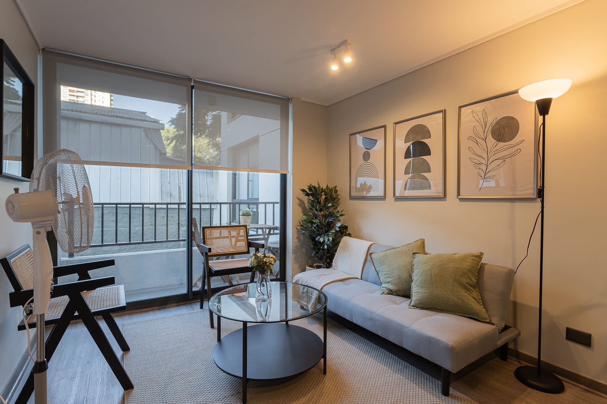 Relax in this stylish living room with modern decor and a cozy vibe, perfect for unwinding after a day of exploring.