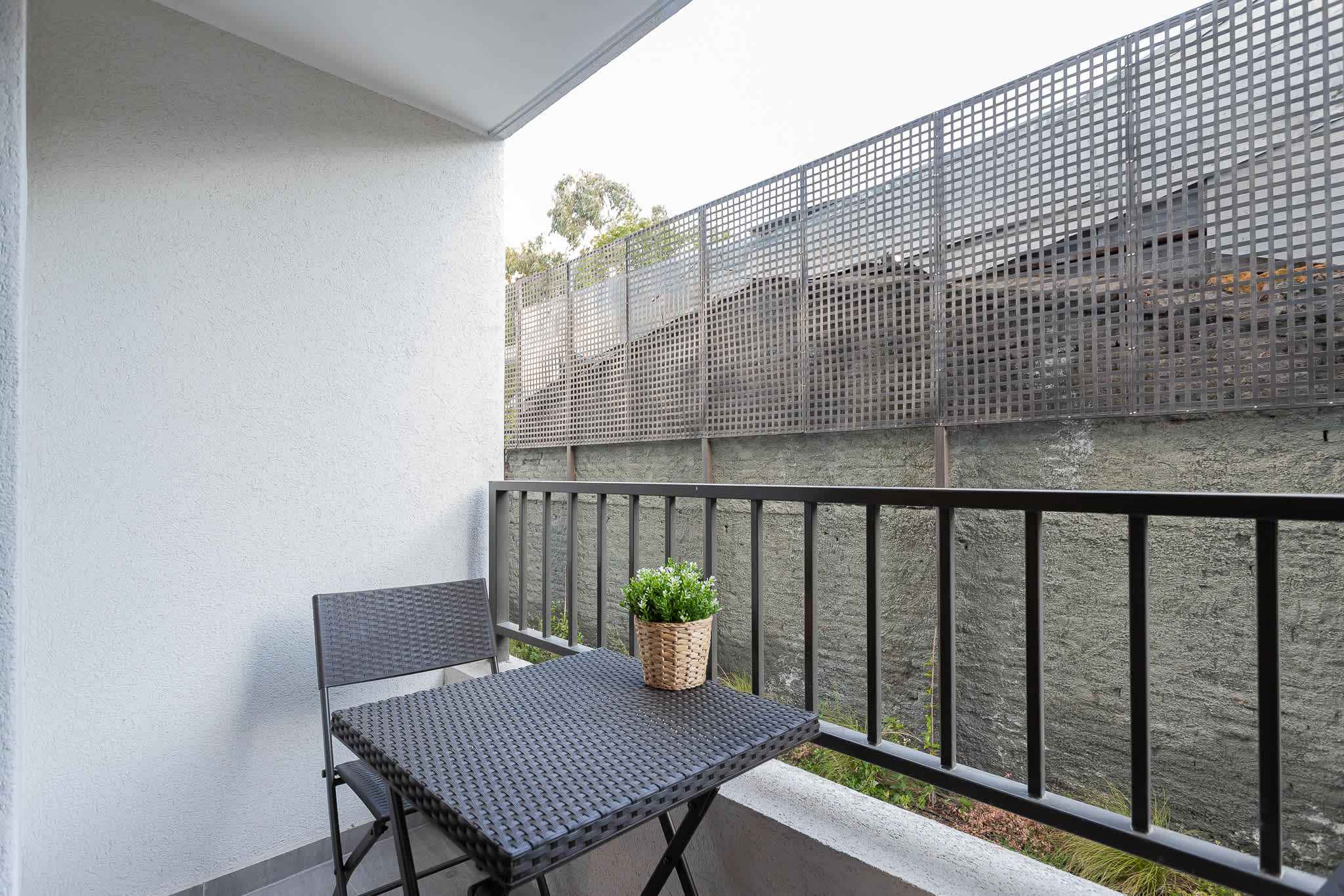 Enjoy a quiet morning coffee on your private balcony, perfect for relaxation in the heart of the city.