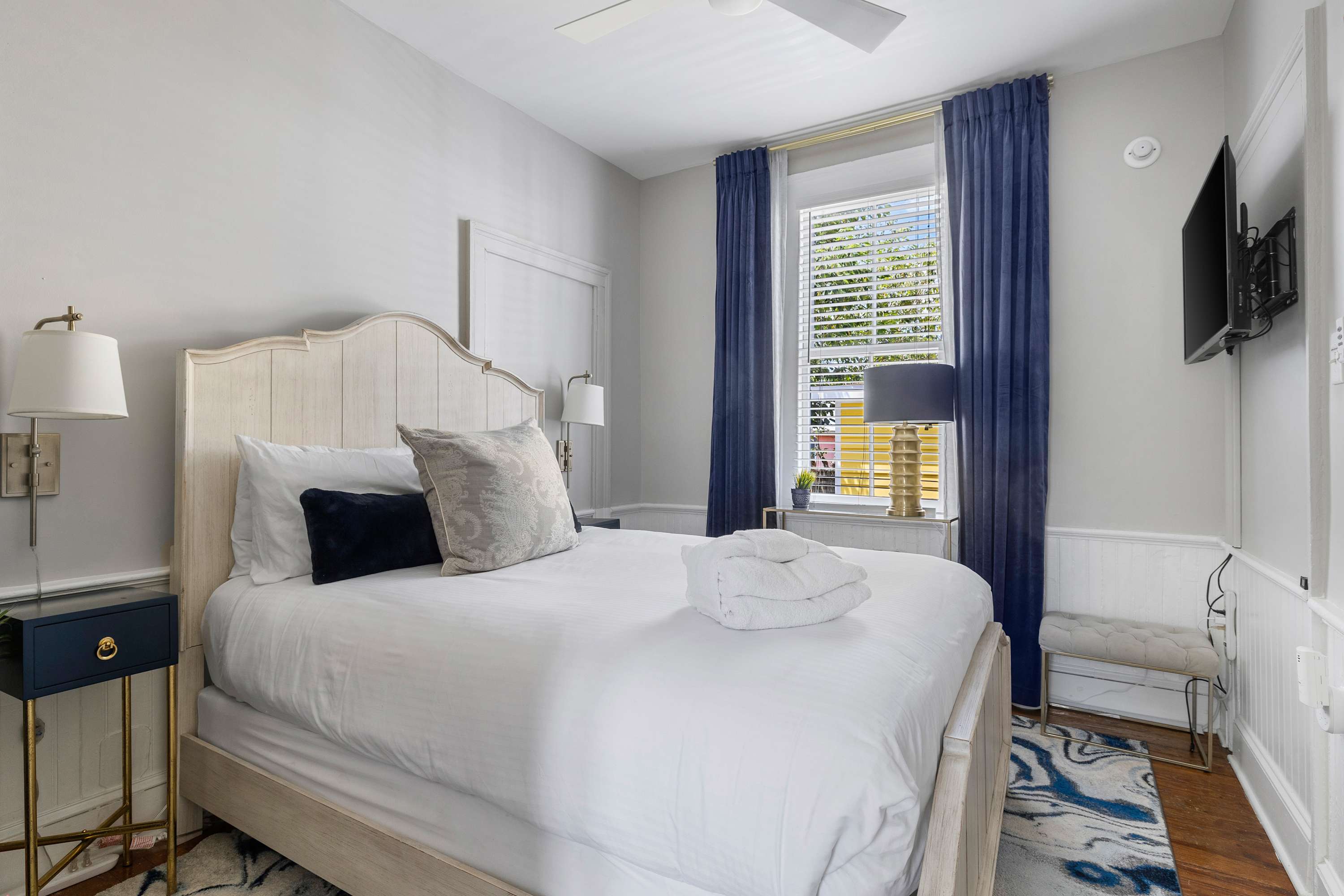 Bedroom #1: Queen Bed + Ceiling Fan + TV