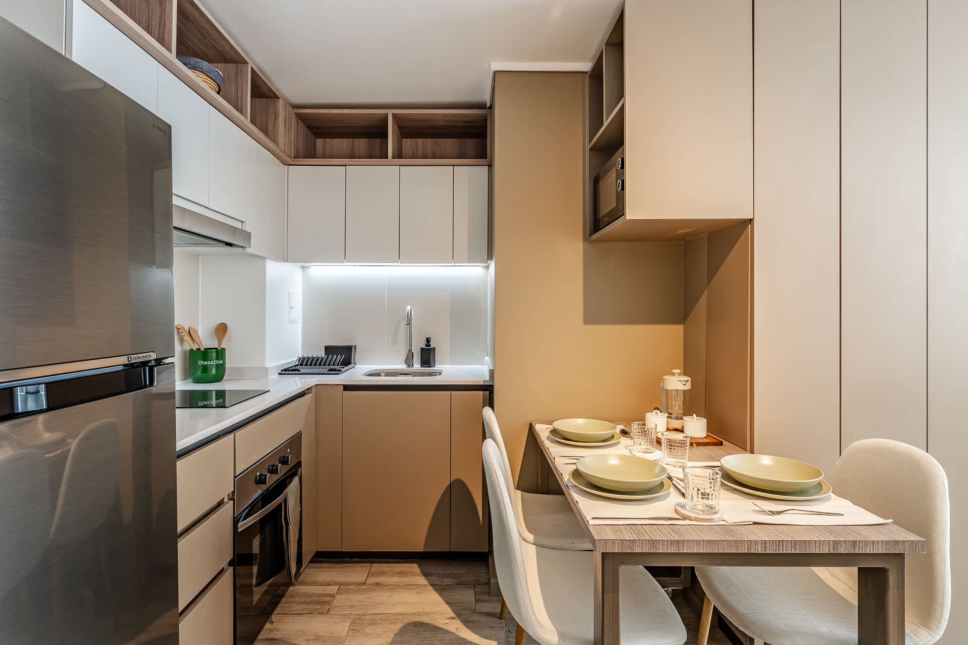 Experience culinary delights in this modern kitchen, featuring sleek appliances and a cozy dining area perfect for family meals.