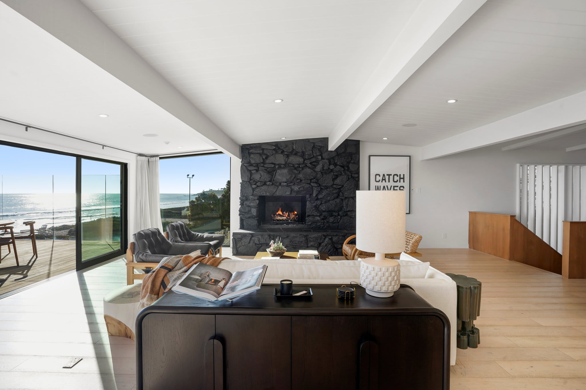 Slide open the glass doors and let the fresh sea air fill the space.