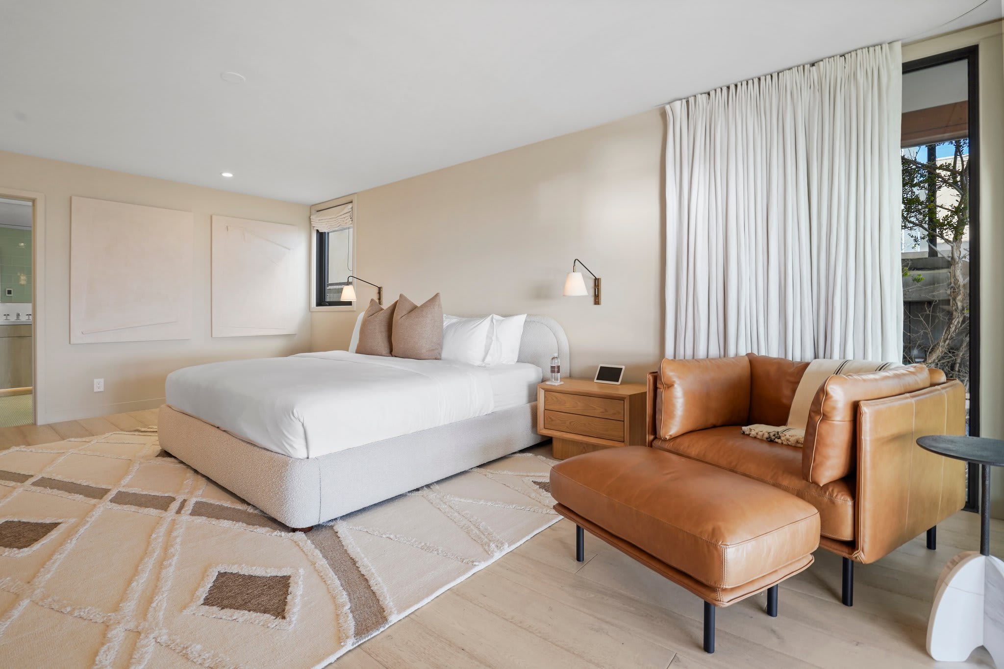 Slip into relaxation with dimmable lighting and room-darkening shades.