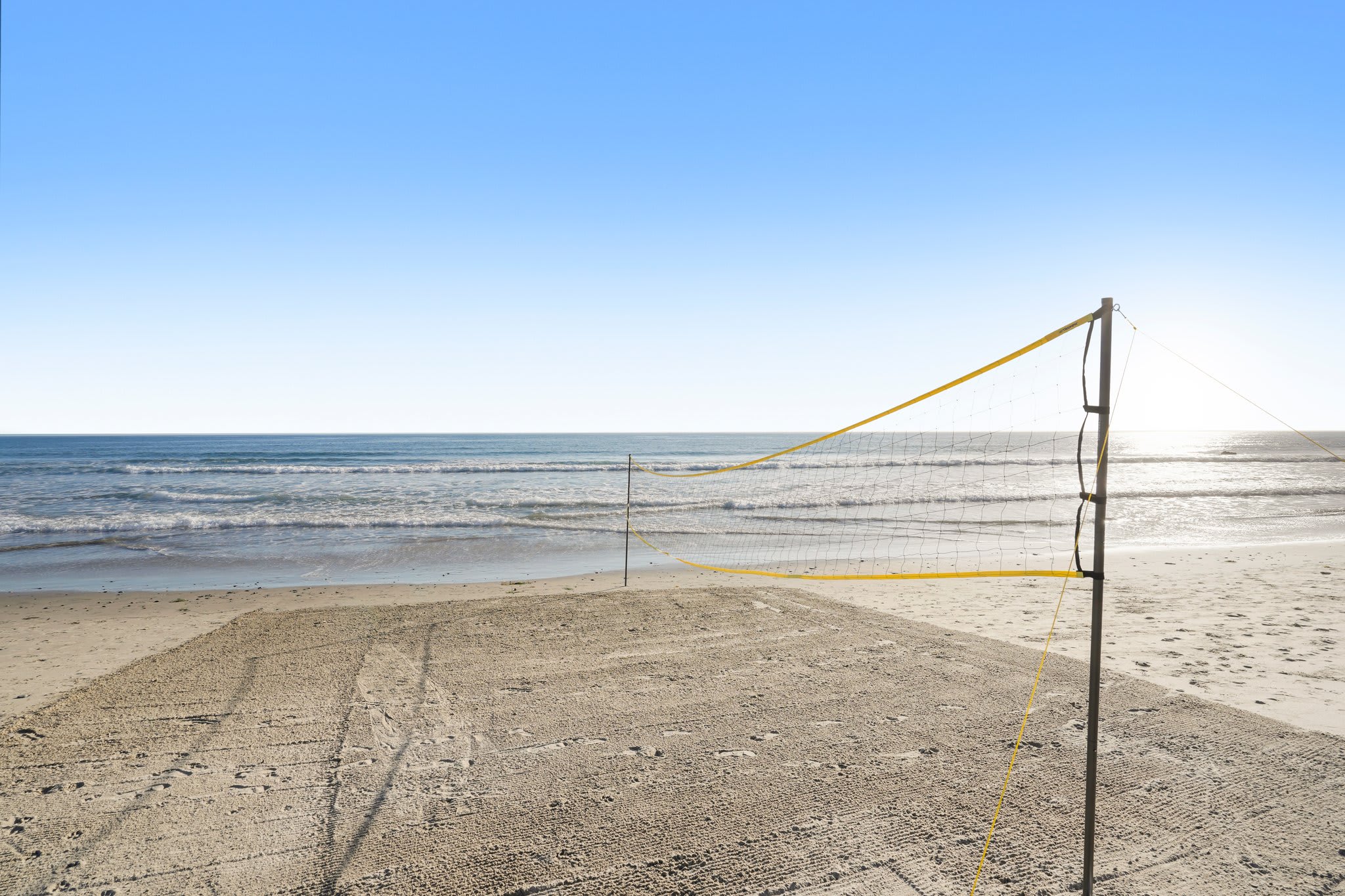 Play under the sun, then cool off in the waves.
