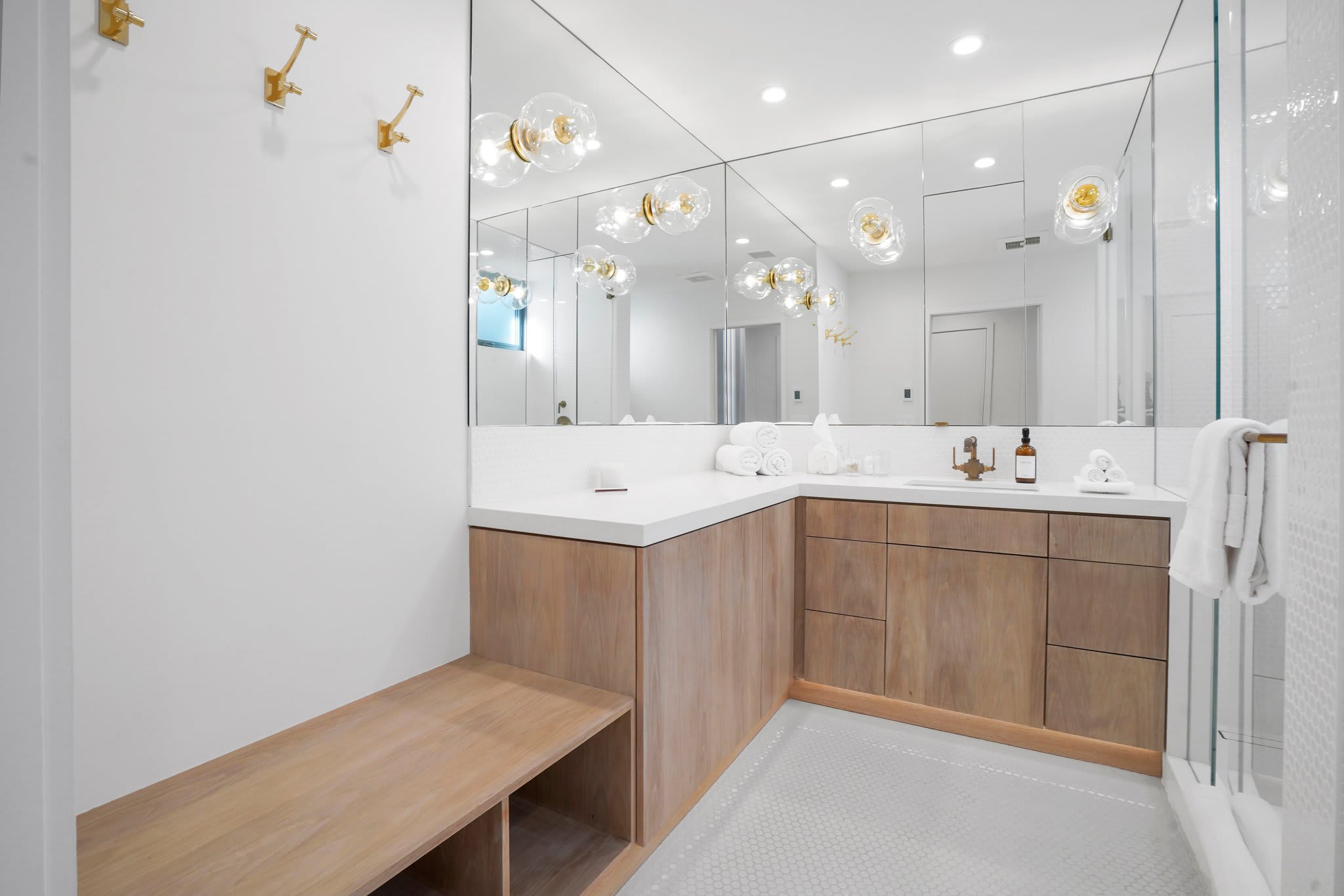 Luxury meets function with sleek finishes and custom wood cabinetry.