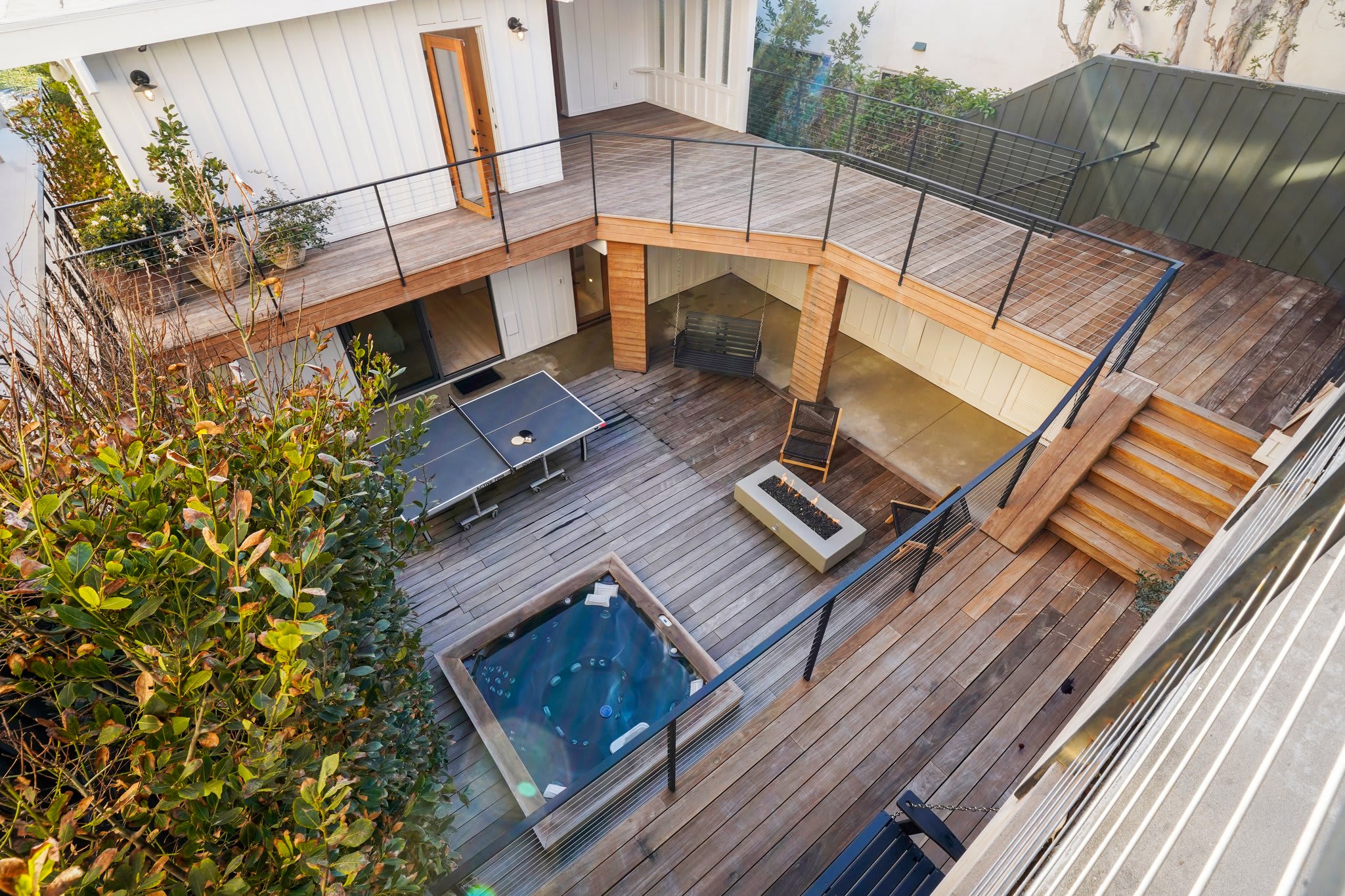 Expansive outdoor spaces seamlessly link multiple levels of the home.