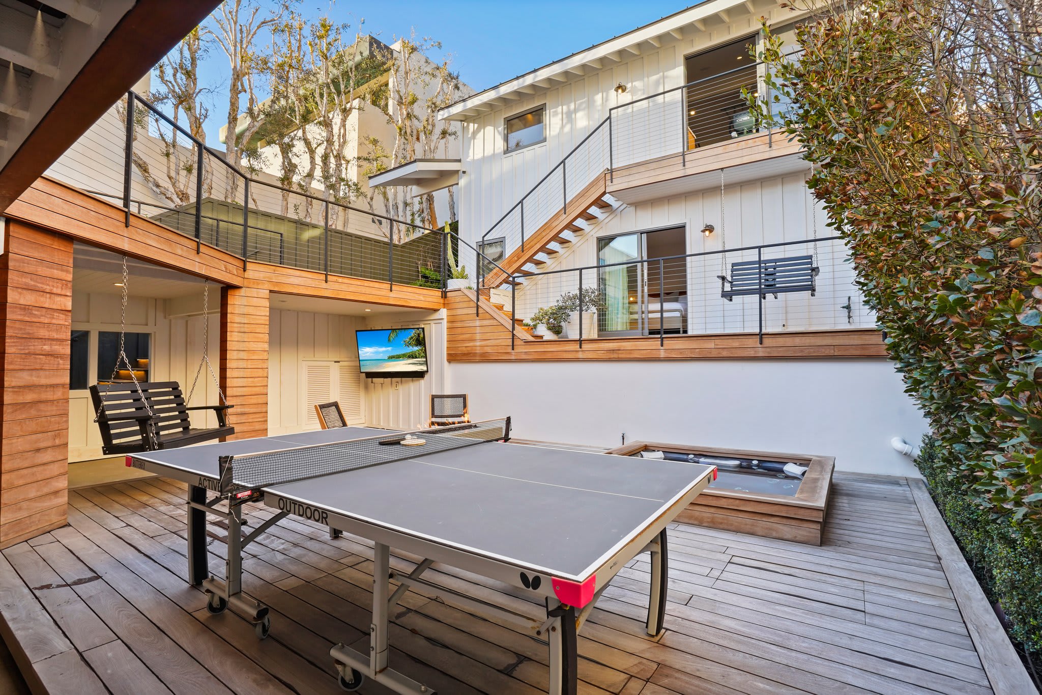 An outdoor retreat designed for fun—ping pong, a firepit, and endless ways to relax.
