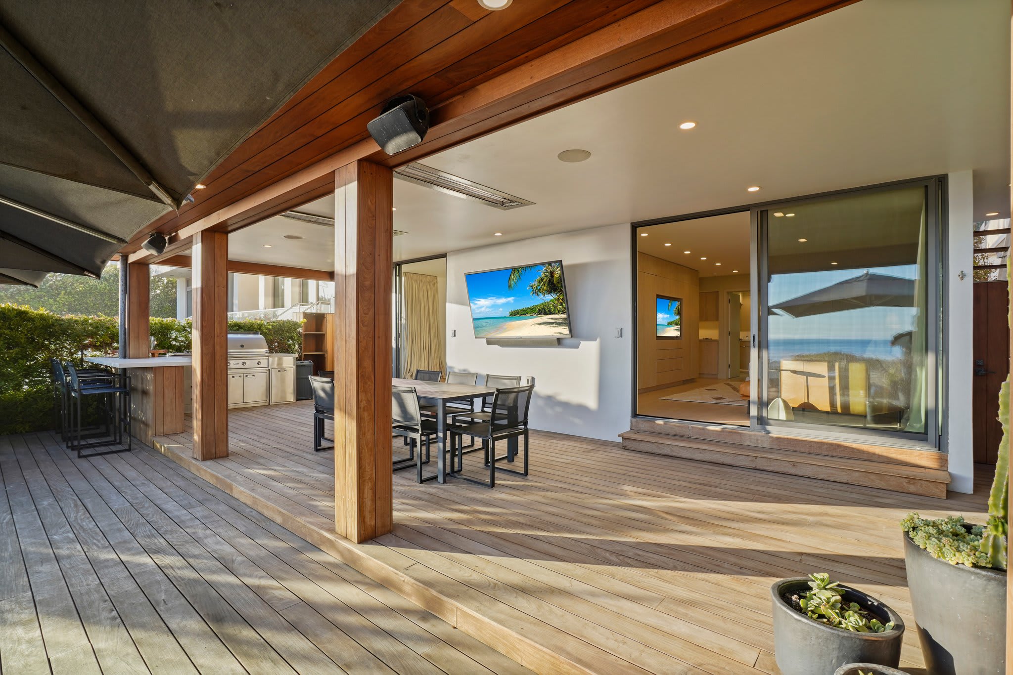 Dine alfresco, catch the game, or just soak in the ocean air—this outdoor retreat has it all.
