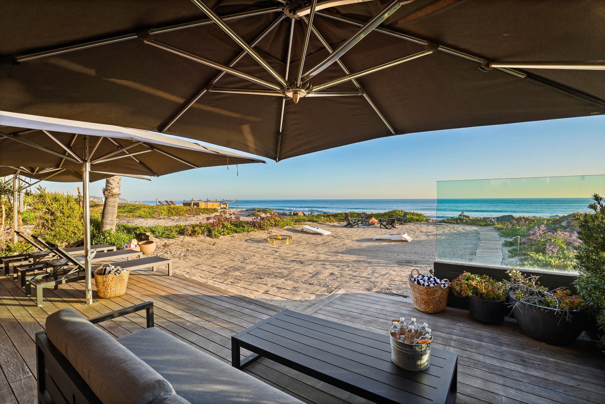 Stretch out on streamlined loungers, just steps from the sand.