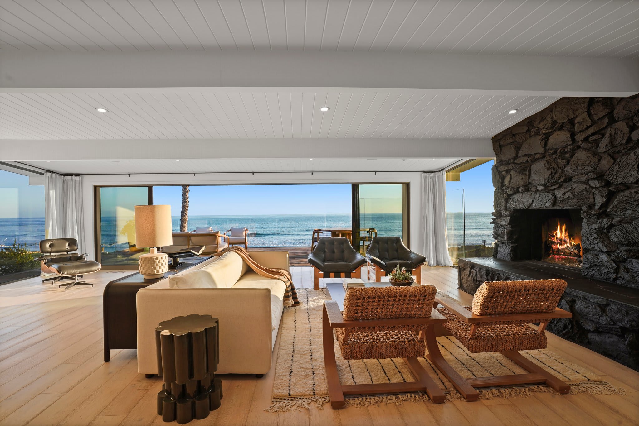 Unwind by the fire, framed by rich textures and uninterrupted views.