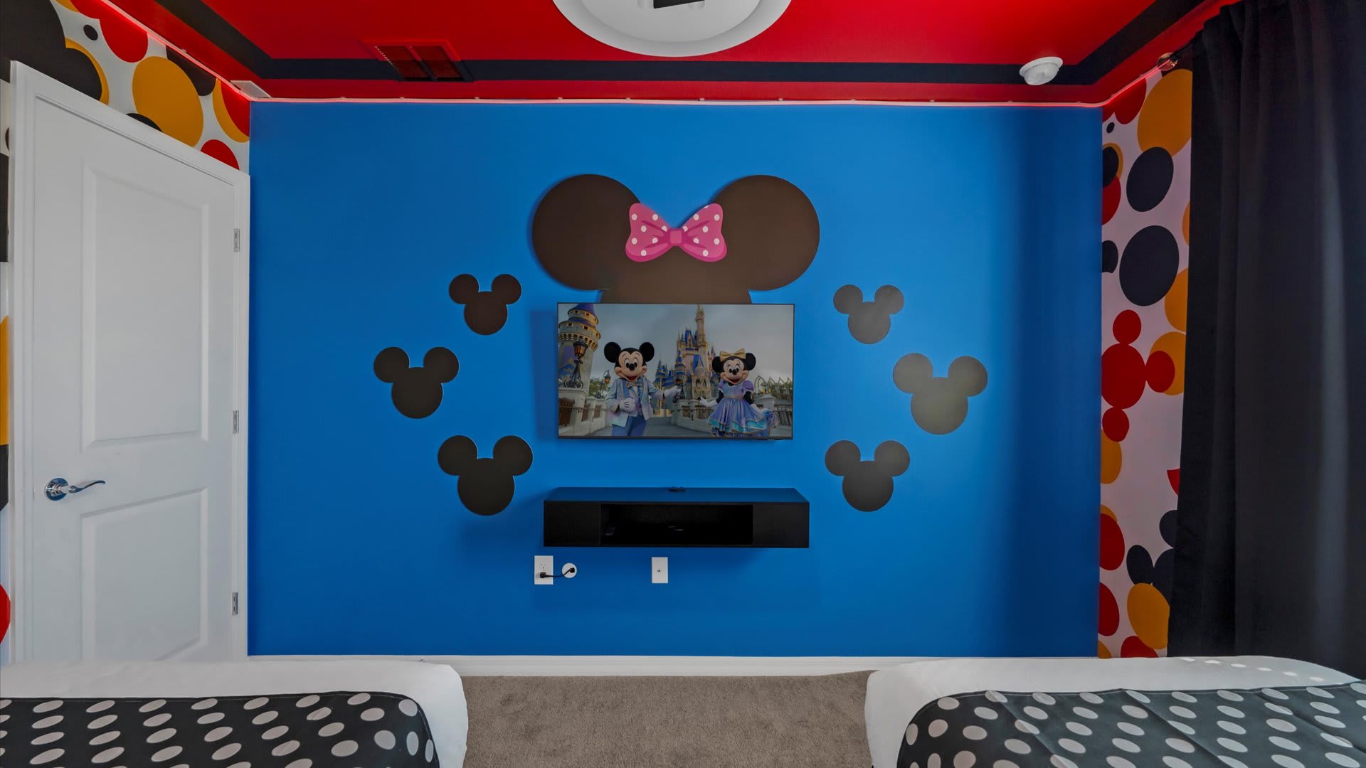 Mickey Mouse themed bedroom with smart TV