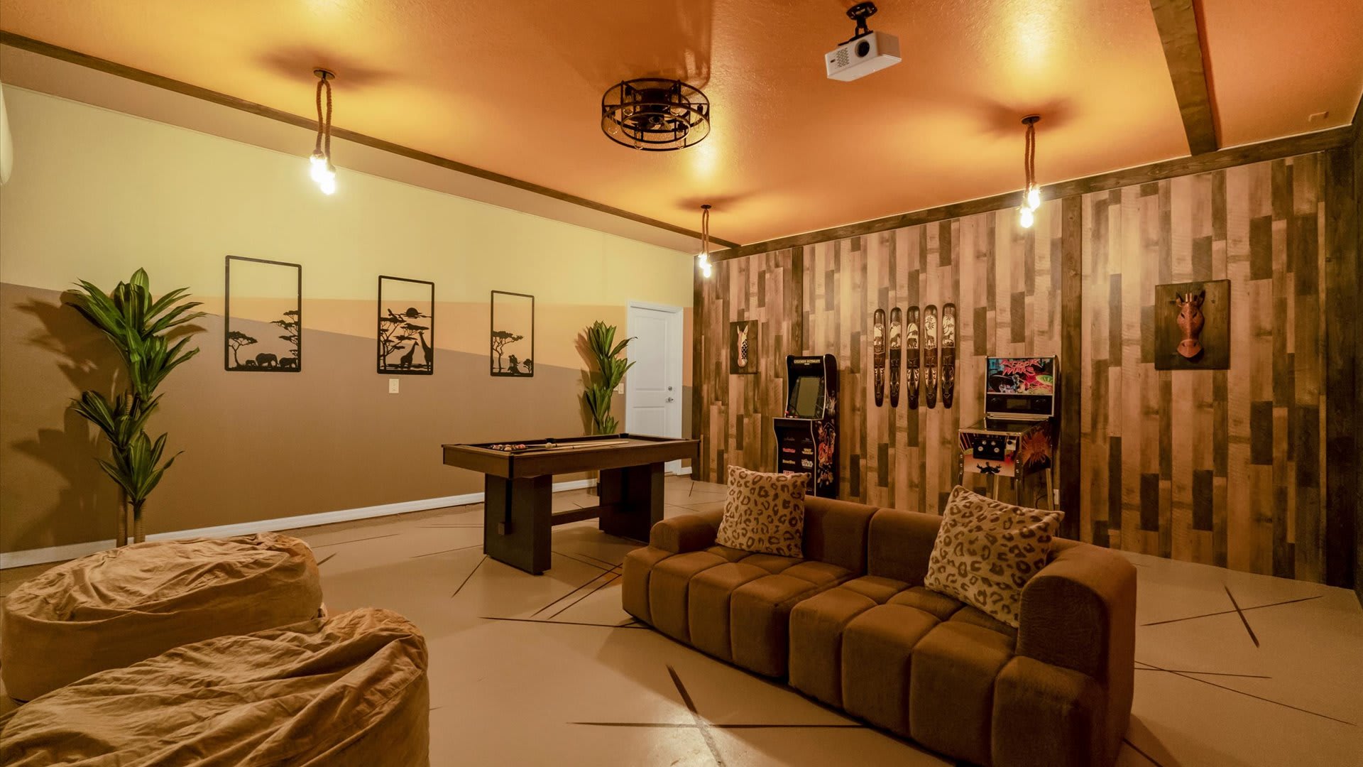 Safari Lion King themed Movie Theater and Games room with pool table
