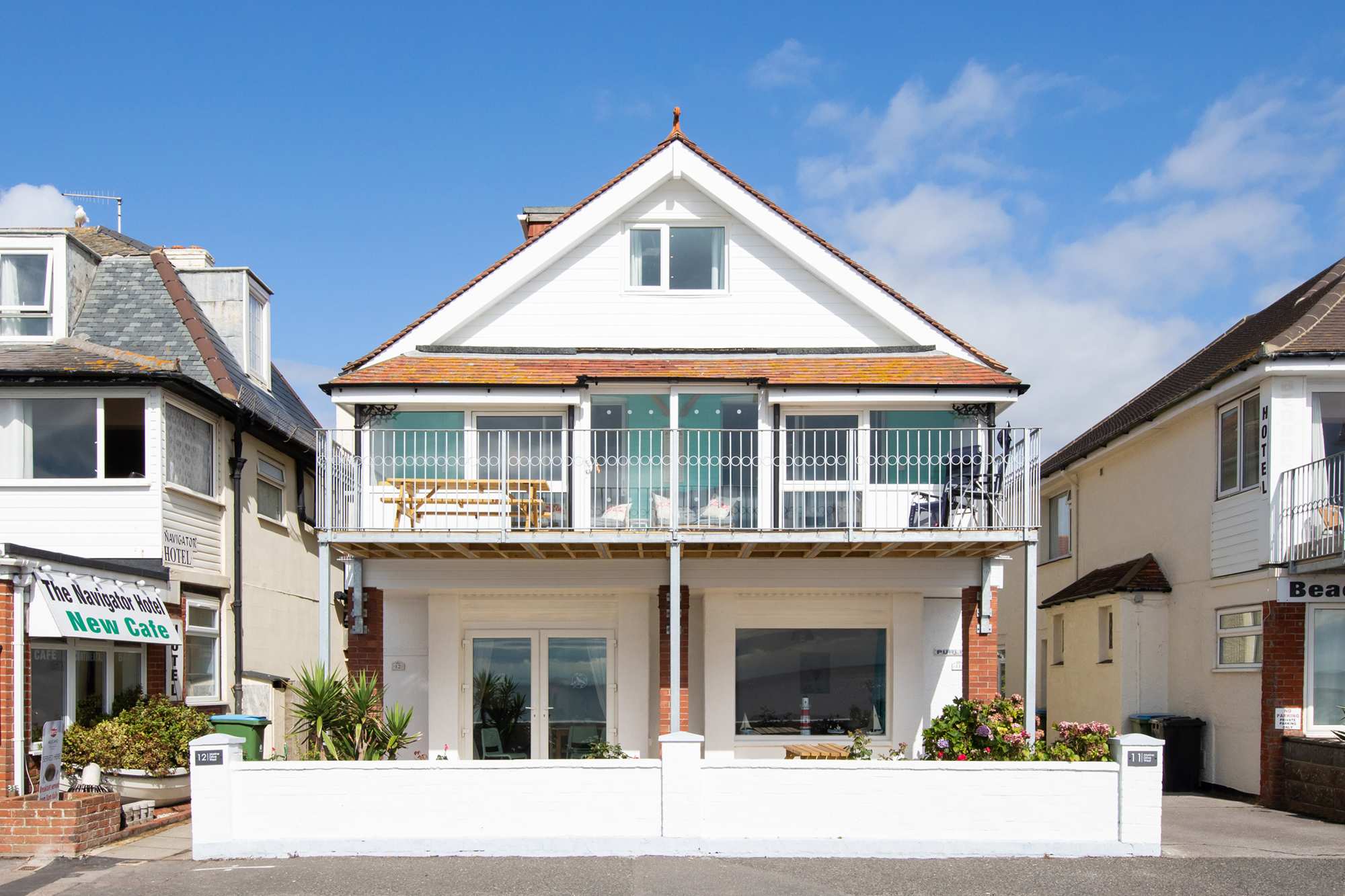 Absolute Beachfront with Decked Garden Oasis and Views