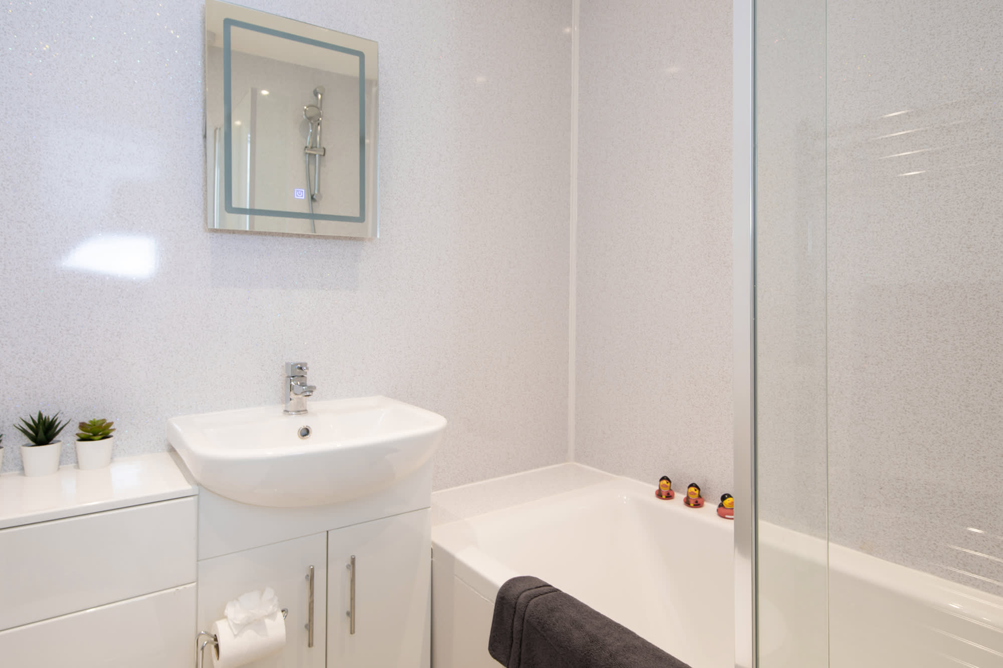 The modern bathroom comes equipped with all the essentials for your stay