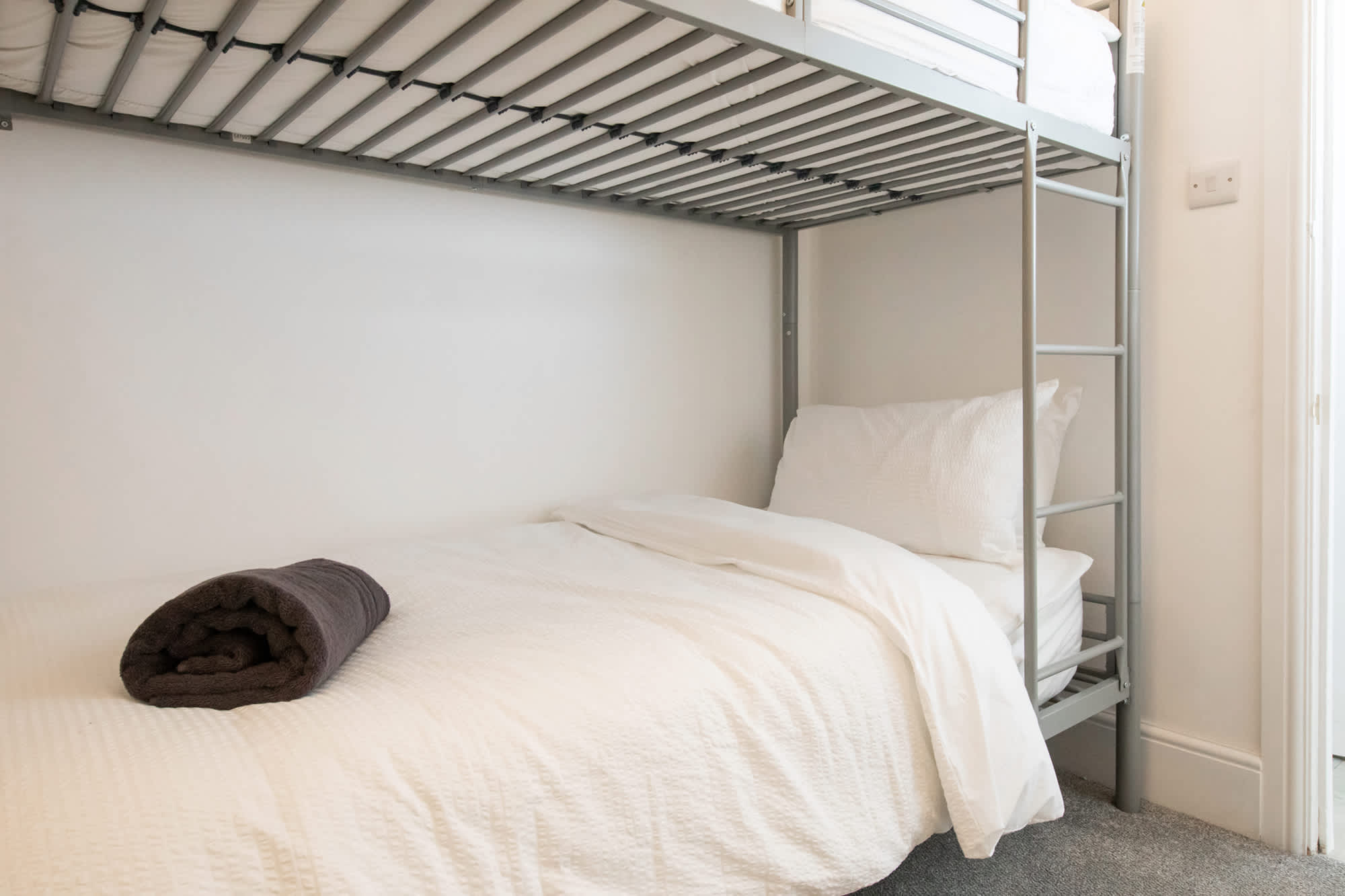 The bunk bed features two comfortable single beds
