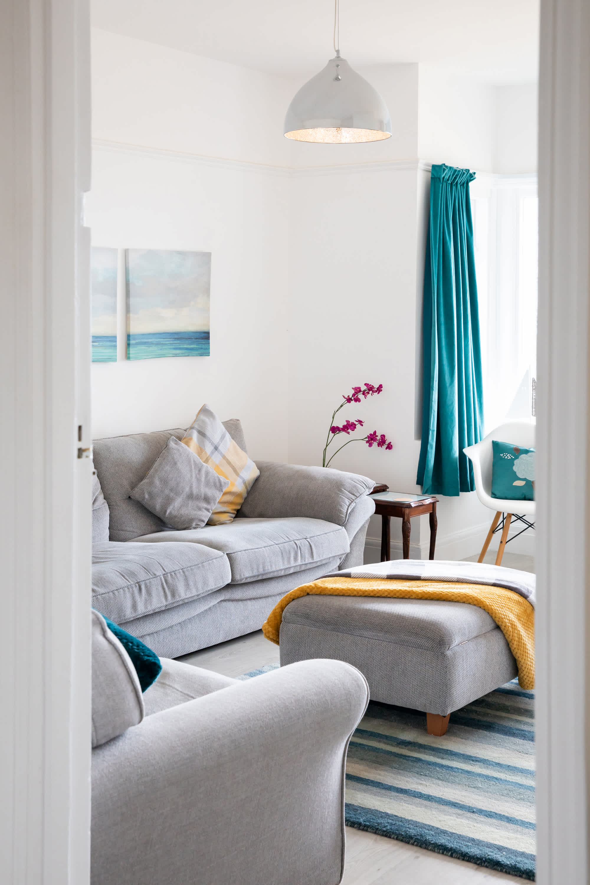 Enter our sunny lounge with lovely sea views