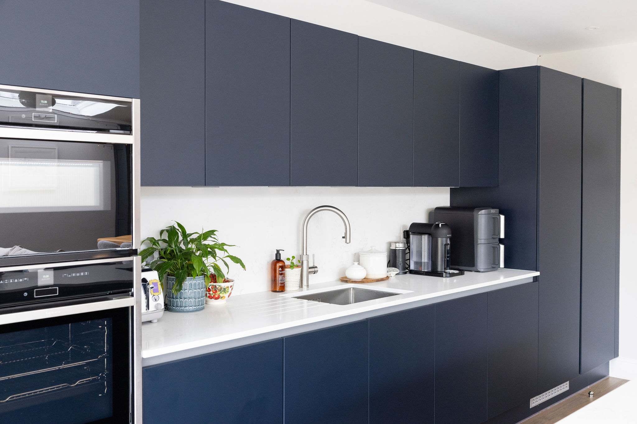 The modern kitchen is fully equipped with state-of-the-art appliances, spacious countertops and ample cabinetry for preparing and cooking.