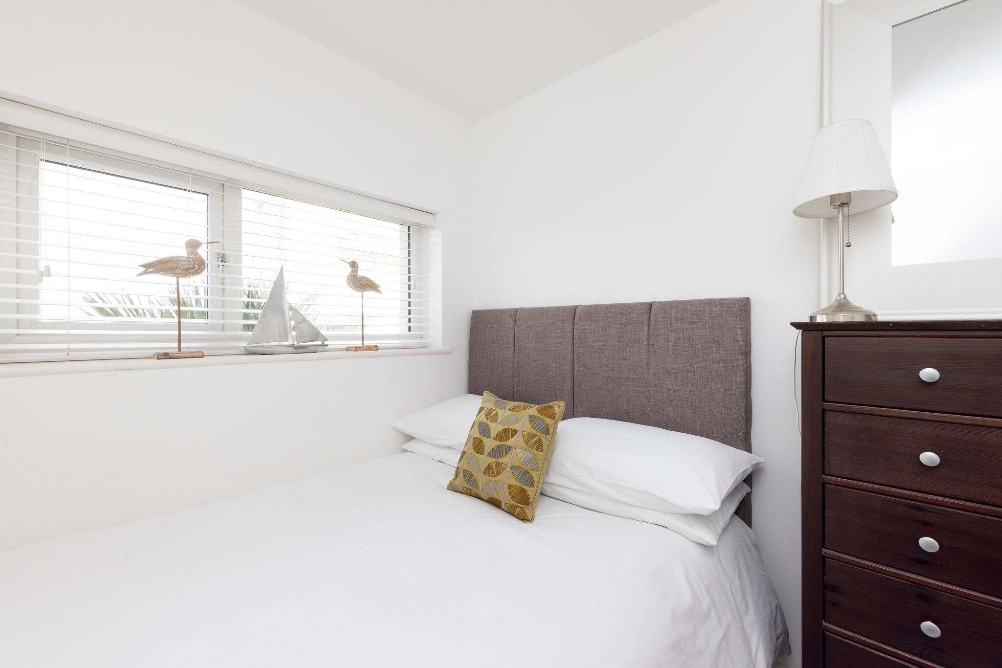 Bedside reading lamp and chest of drawers for your convenience!