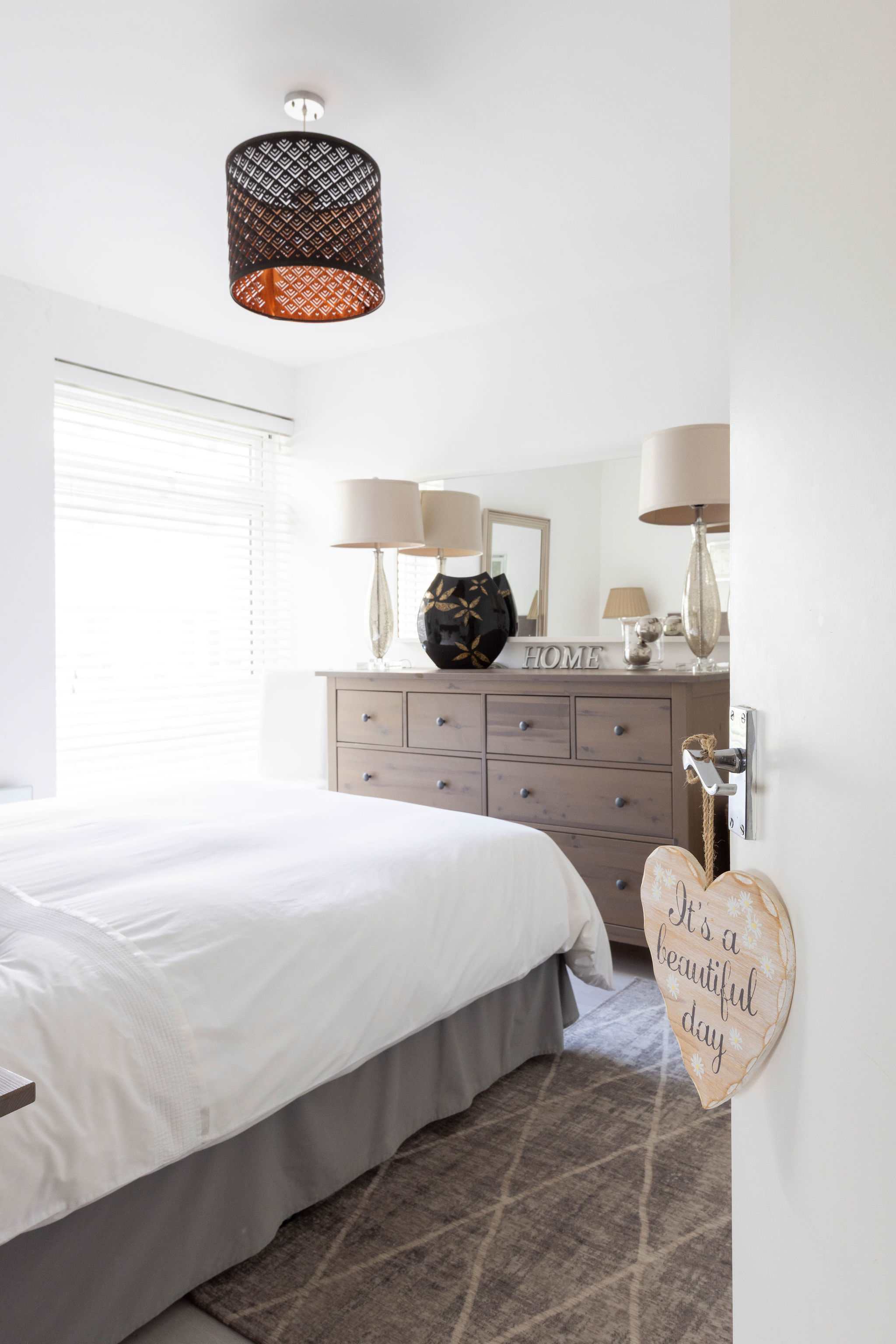 It's a beautiful day.....to stay in this warm and welcoming bedroom!