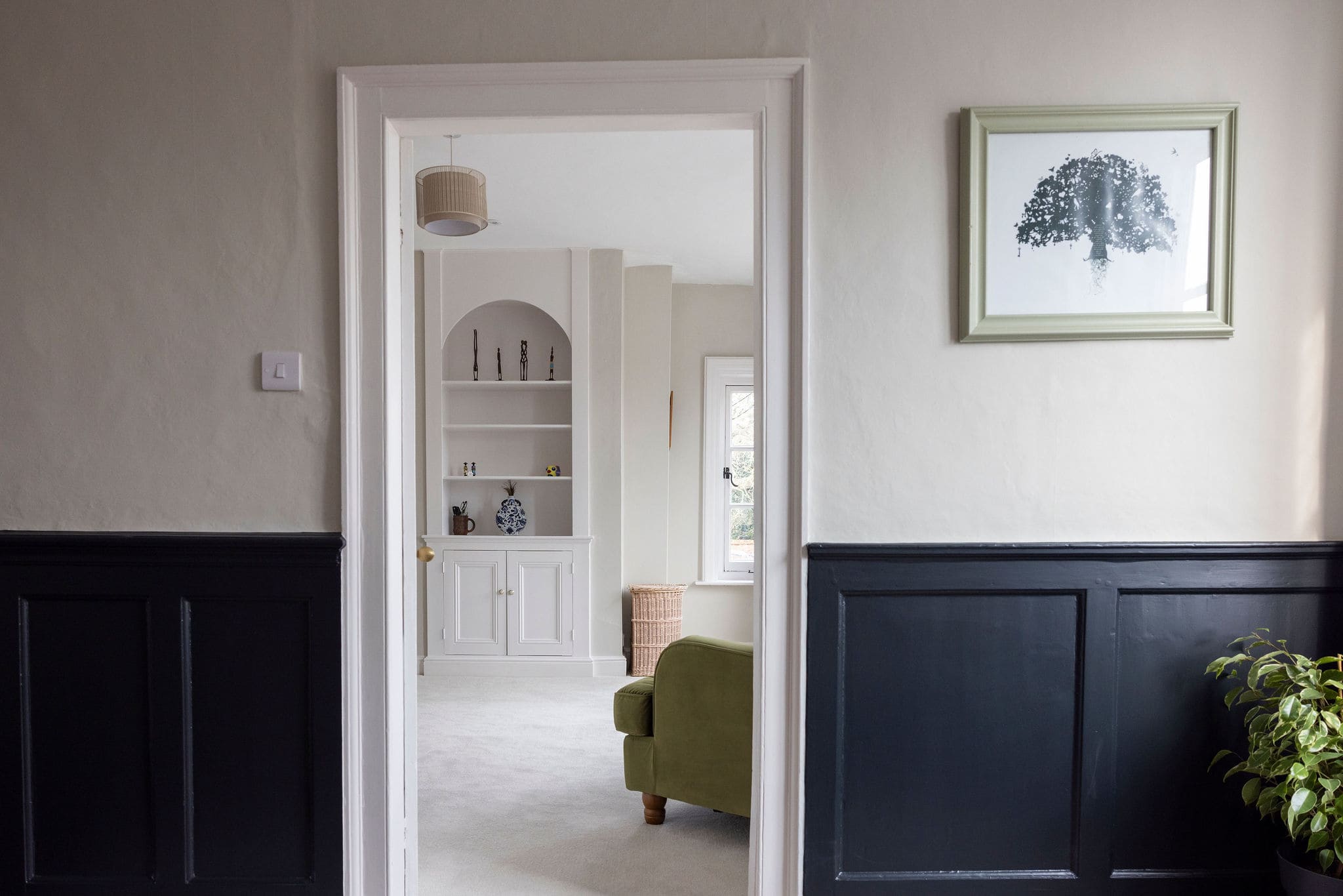 Charming hallway with classic paneling and modern touches