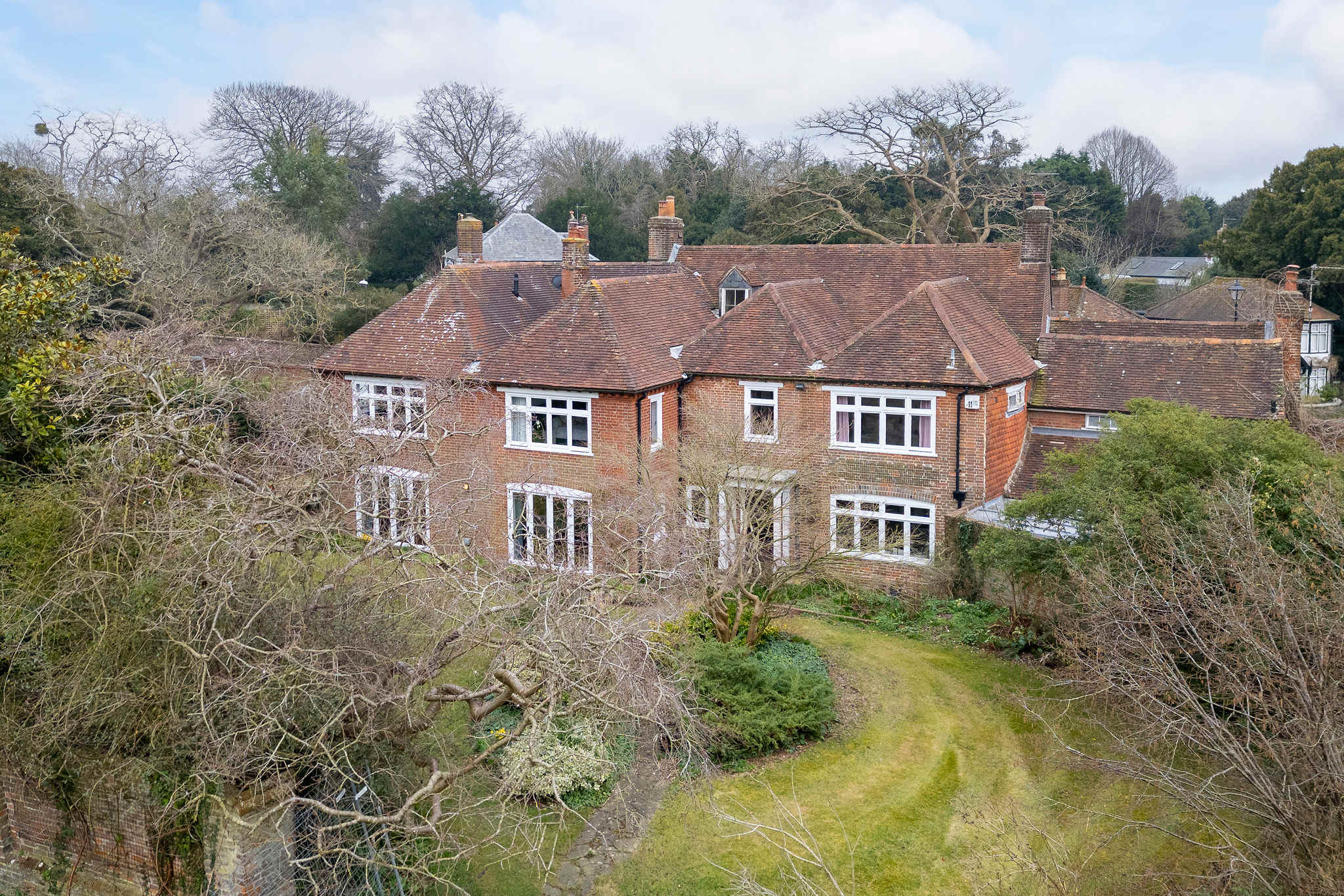 Tranquil garden escape with mature trees and different lawn areas