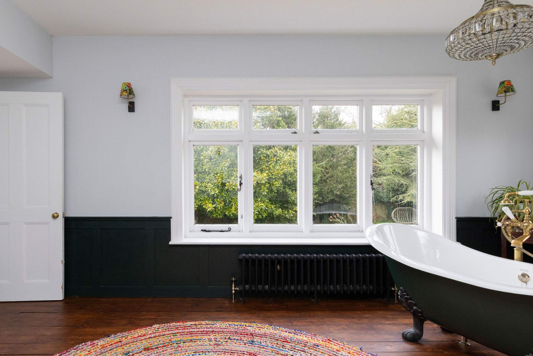 A grand window fills the space with natural light