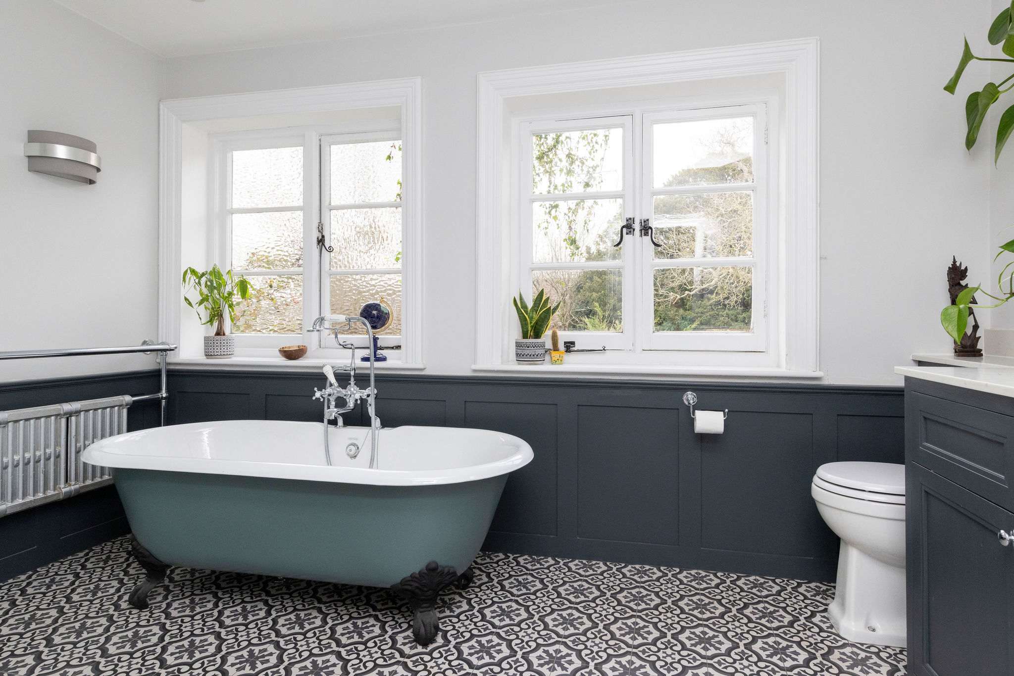 Elegant tiles and vintage fixtures add character