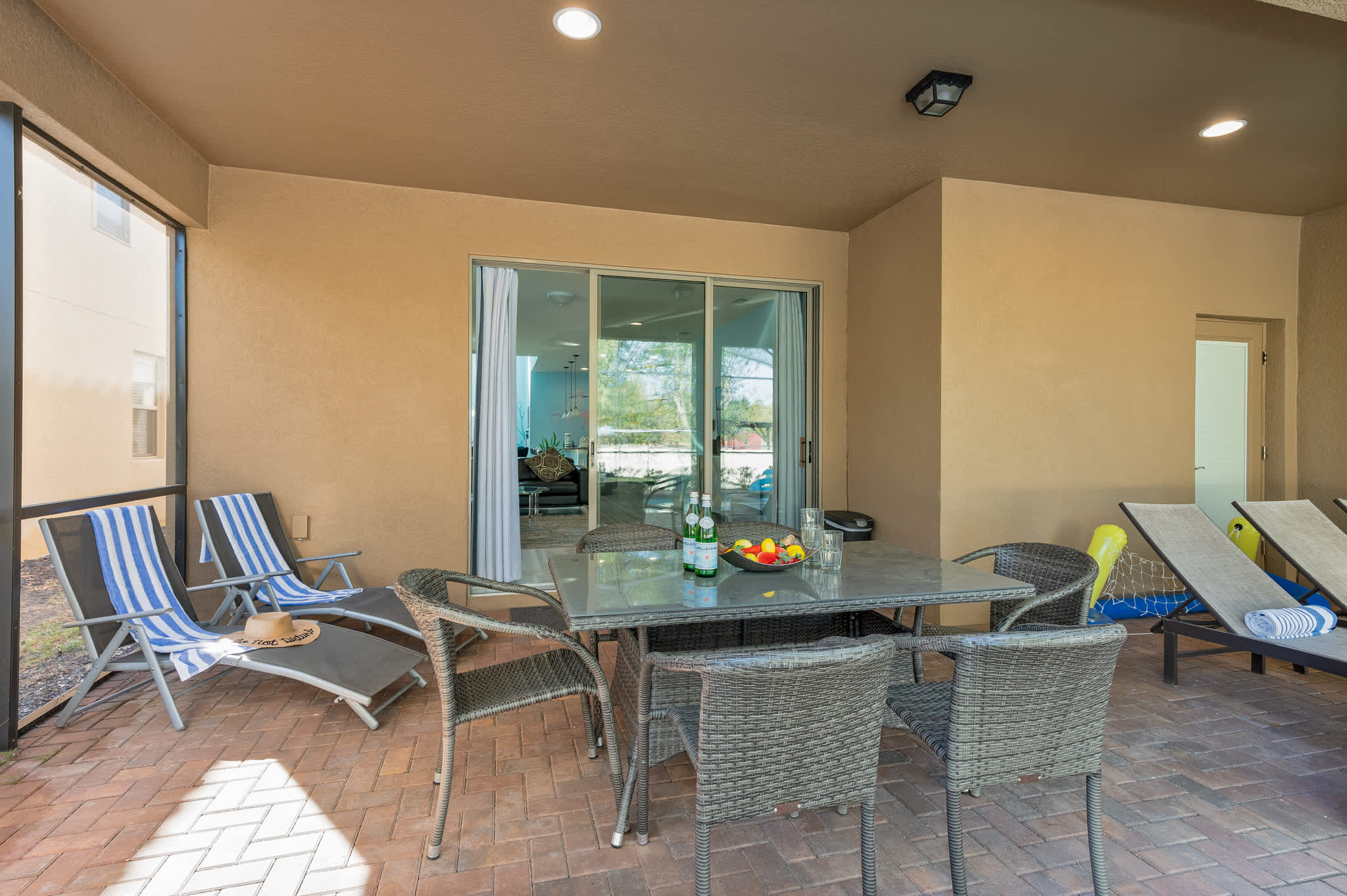 Our patio features ample seating for dining and lounging, perfect for entertaining and enjoying the Florida weather.