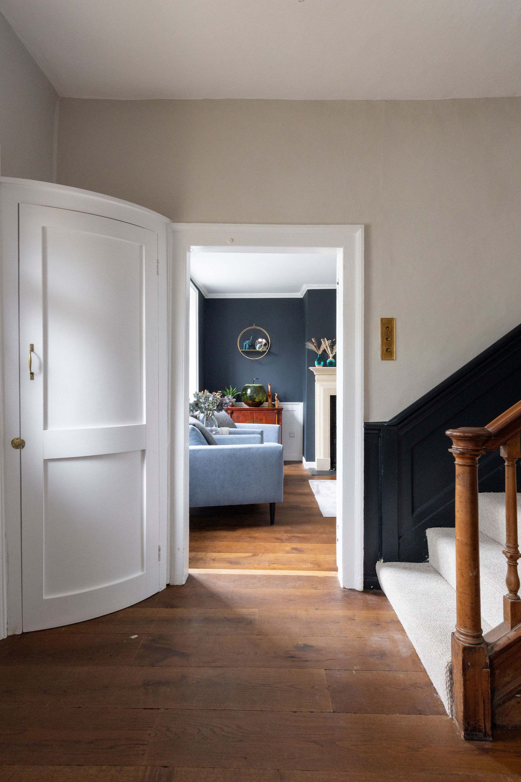 A stylish hallway leading into a warm, inviting lounge