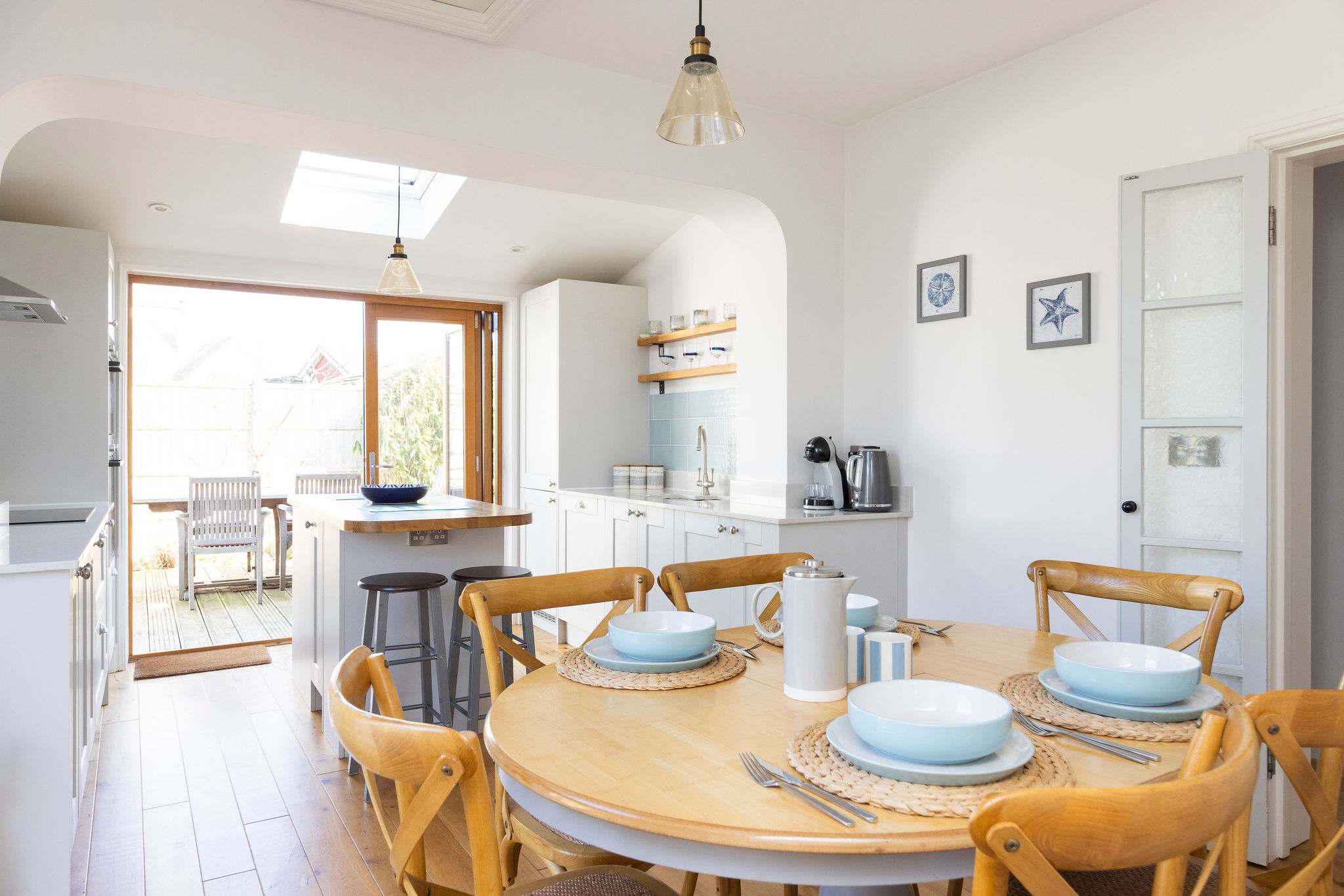 This welcoming space features a fully equipped kitchen and a dining table for six.