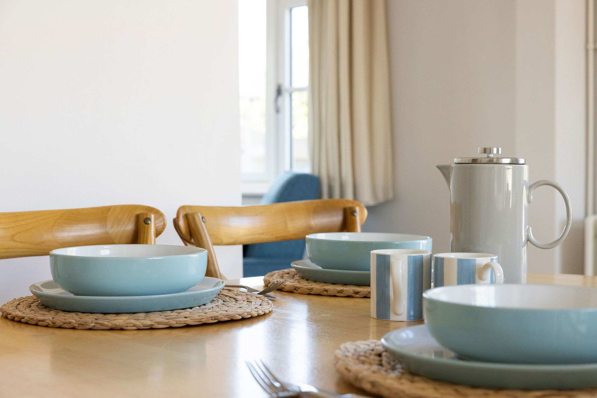 Plenty of plates and cutlery for guests.