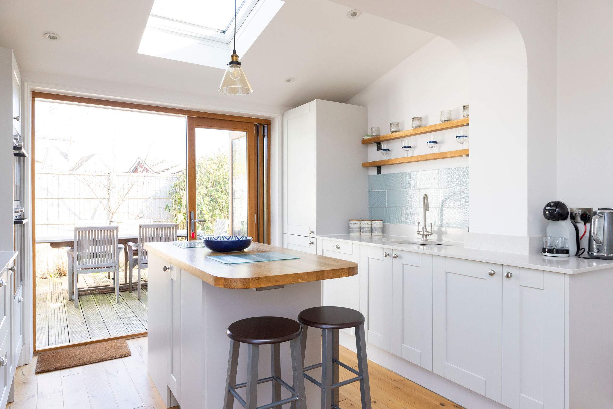 Our modern kitchen offers a great space for cooking and casual dining, with direct access to the outdoor patio.