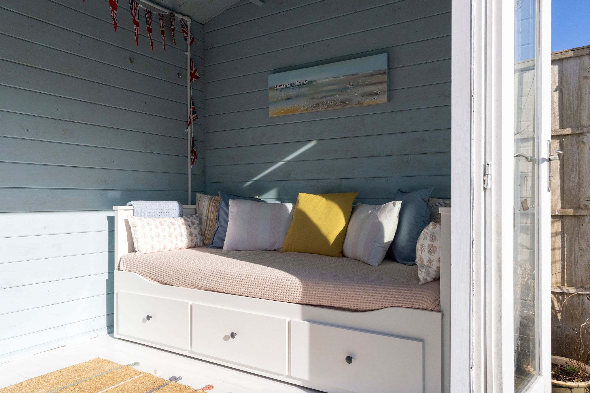 Unwind in the daybed, an ideal spot for reading or enjoying a quiet moment.