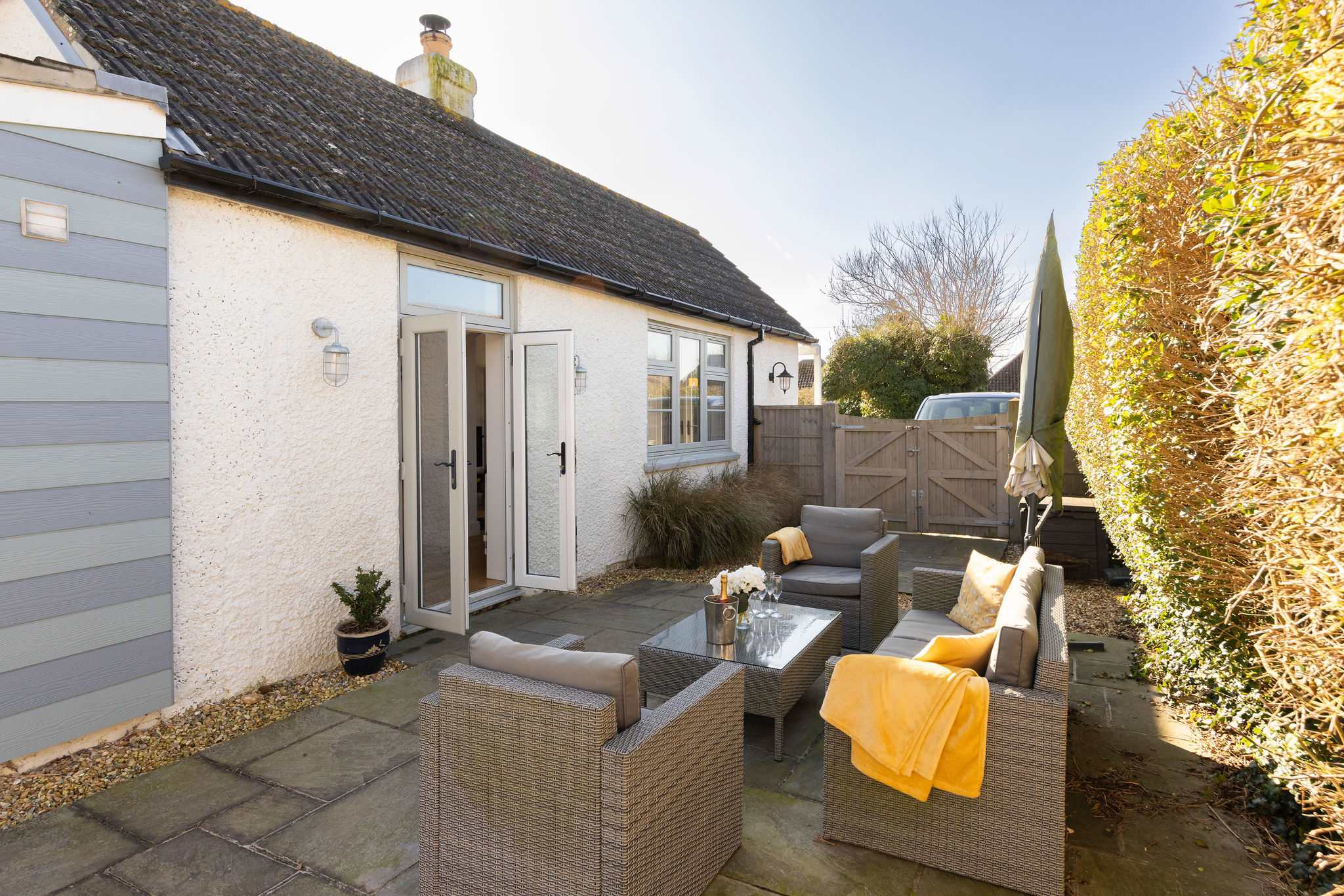 Enjoy sunny mornings and evenings on the secluded patio, perfect for coffee or al fresco dining.