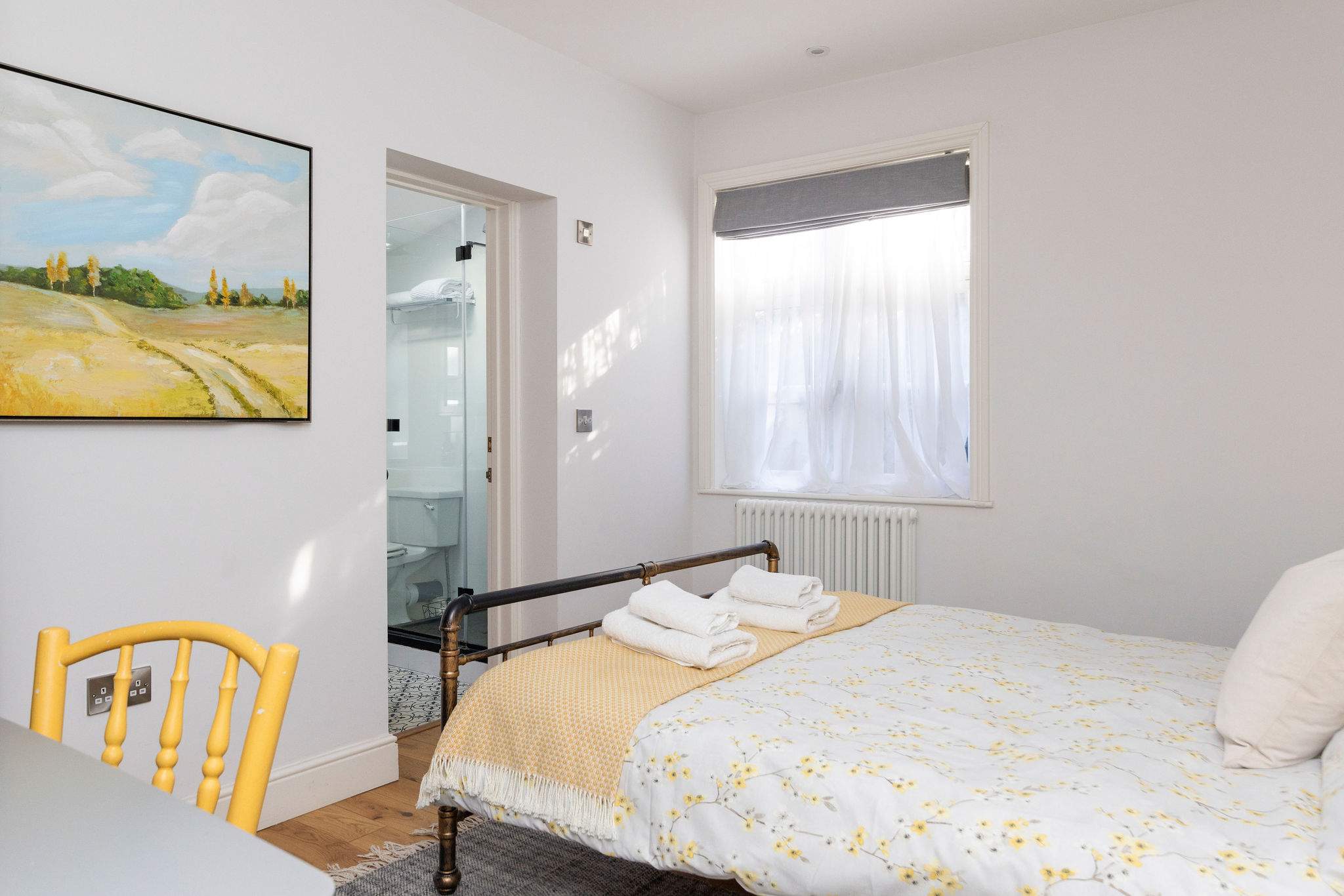 Bedroom 1 This cosy bedroom offers a comfortable king size bed with fresh linens and easy access to the en-suite bathroom.