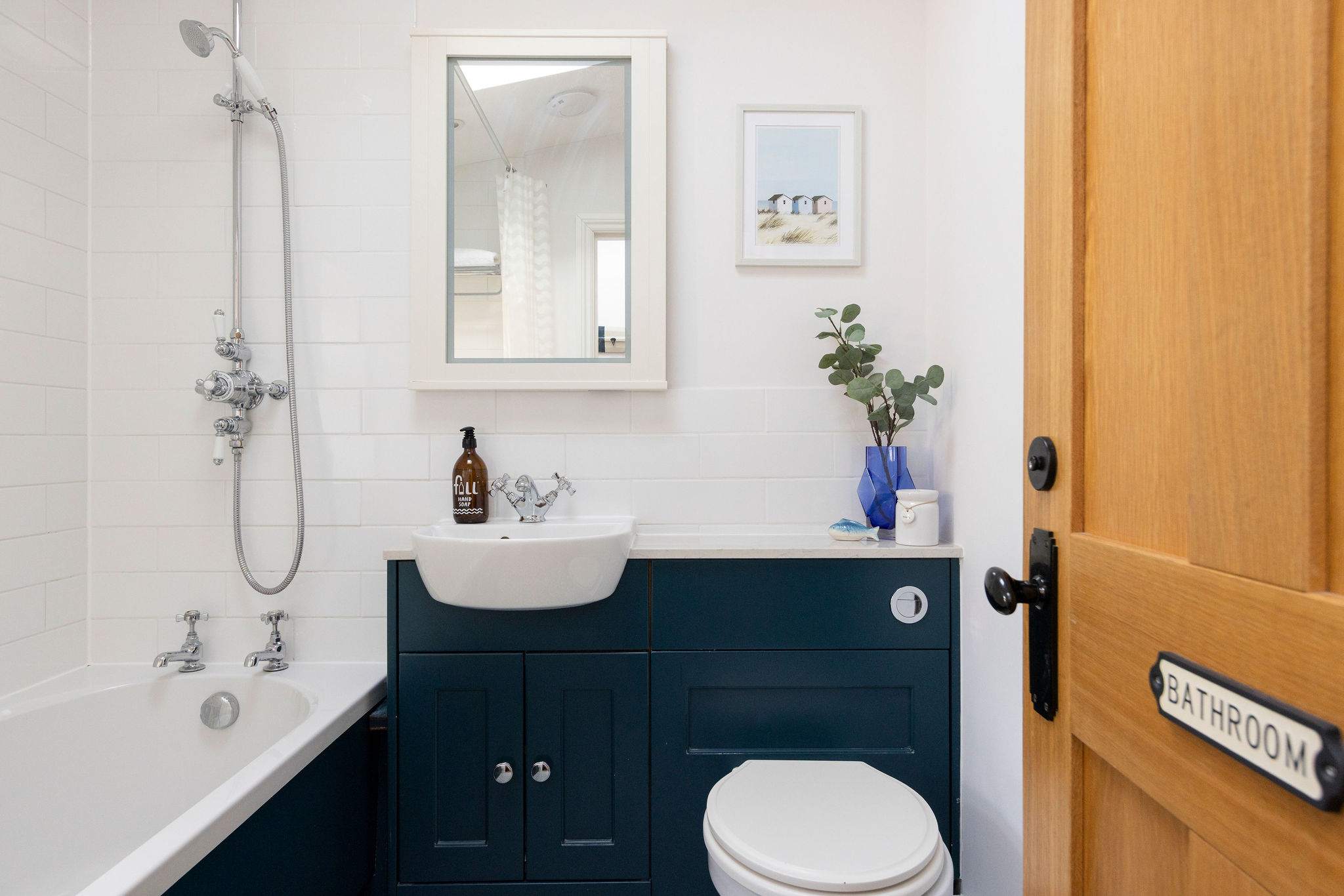 This charming cottage features a well-appointed family bathroom with a bath and shower.