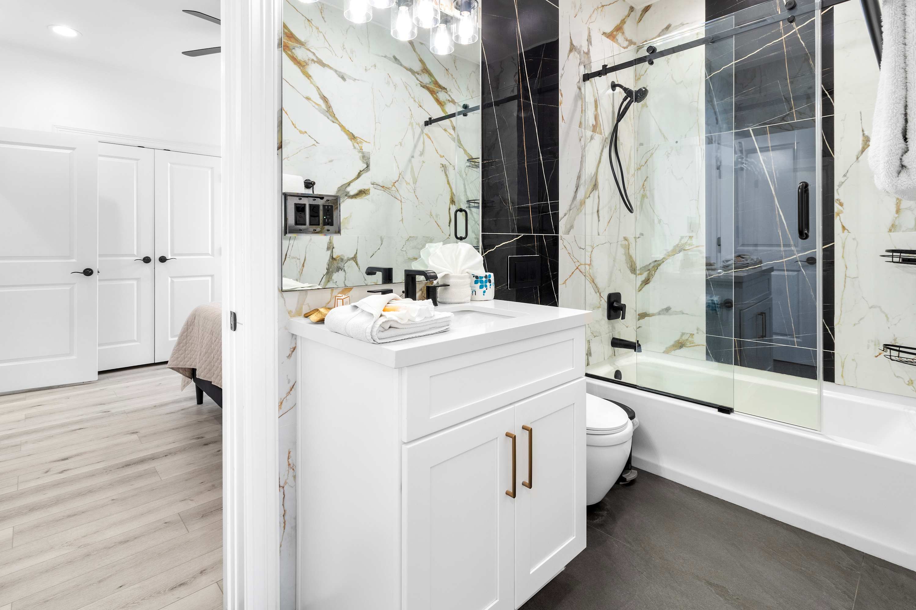 Full shared bathroom with combined bathtub and shower