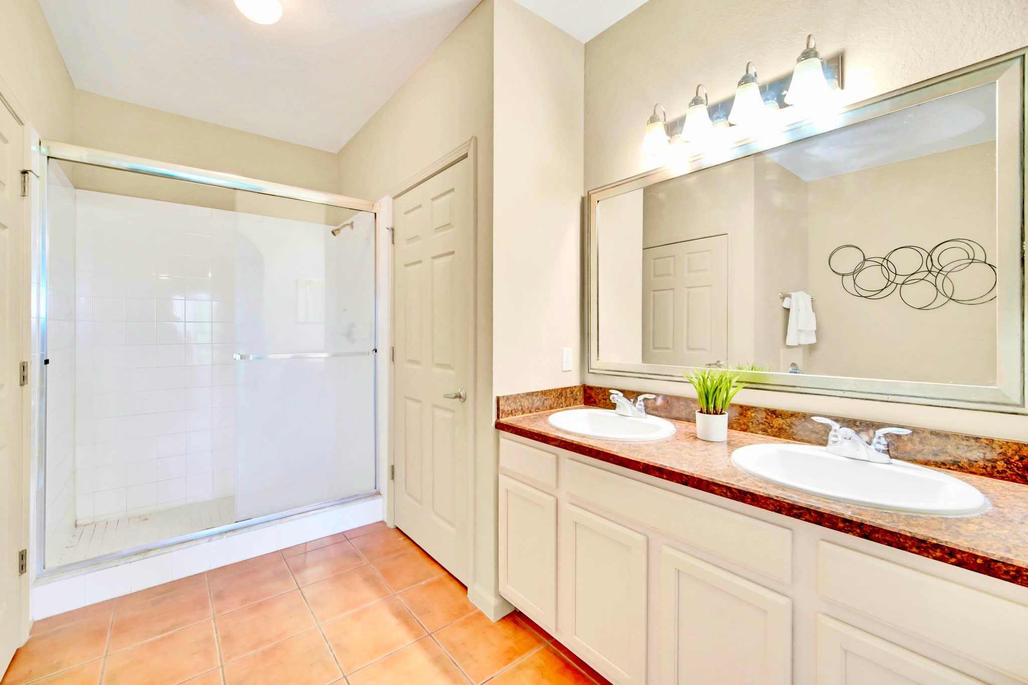 En-suite bathroom with double vanity and walk-in shower