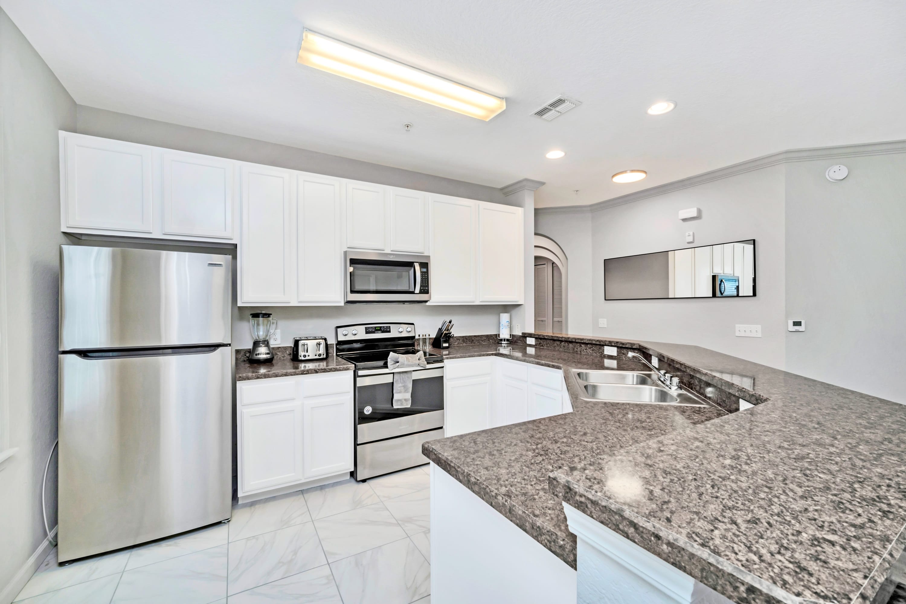 Kitchen area with silver appliances 