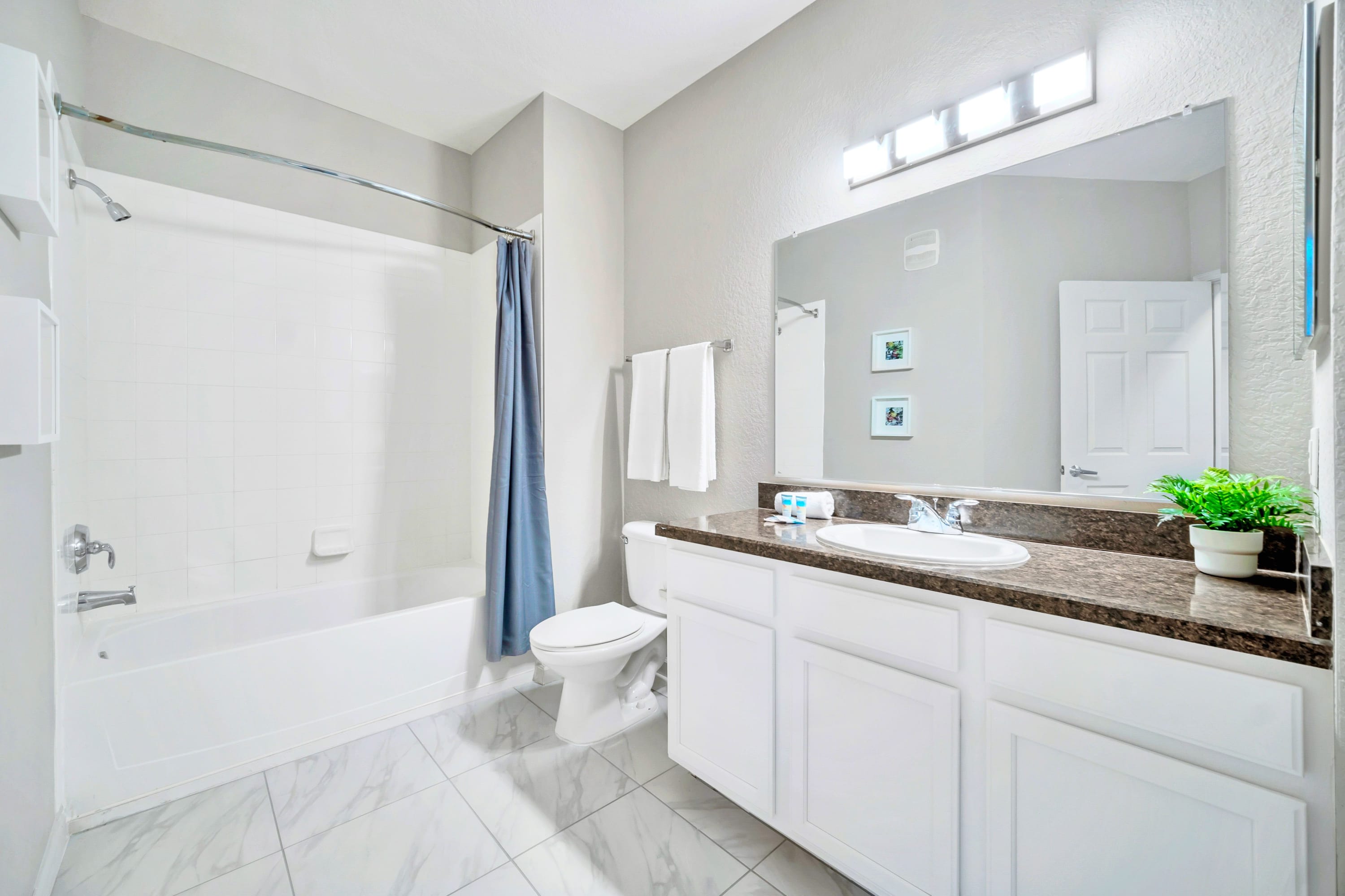 Full bathroom with combined bathtub and shower