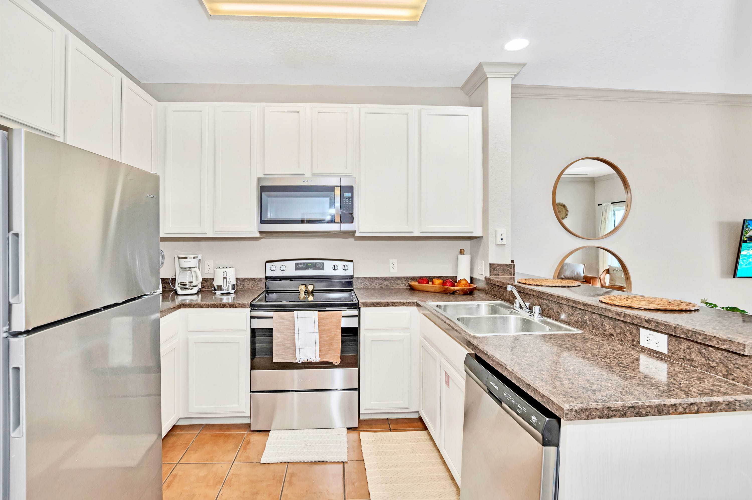 Fully equipped kitchen with silver appliances