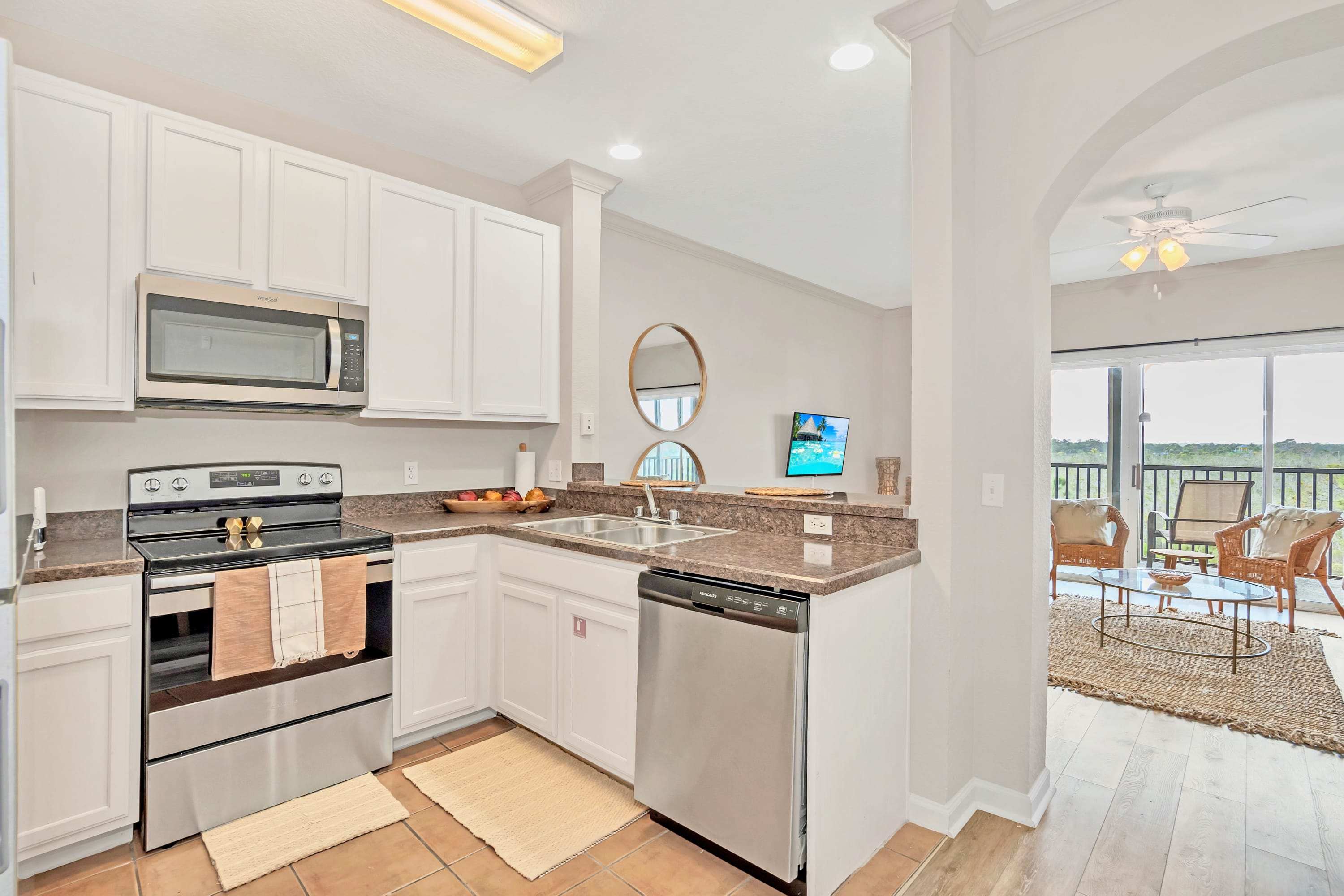 Fully equipped kitchen area with silver appliances