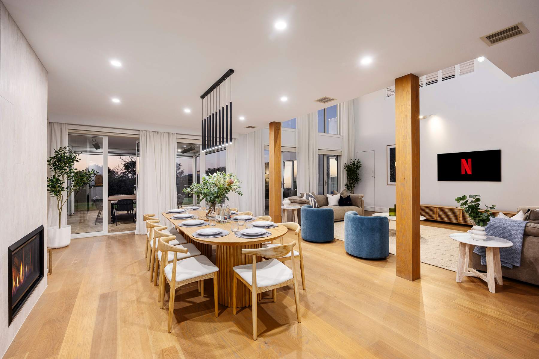 Wide angle view of dining area and living room