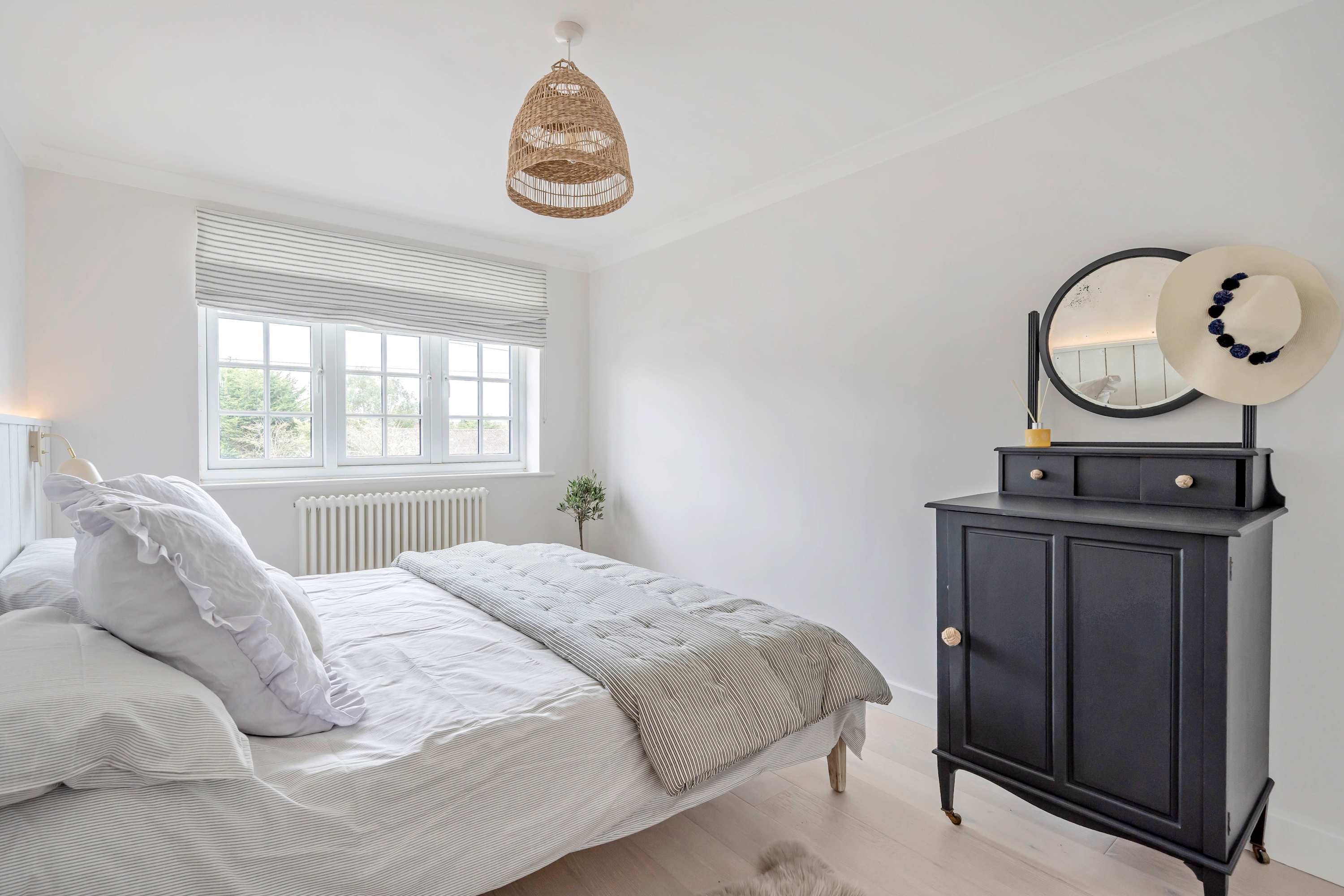 Discover tranquility and enjoy a restful sleep in this lovely bedroom with king bed.