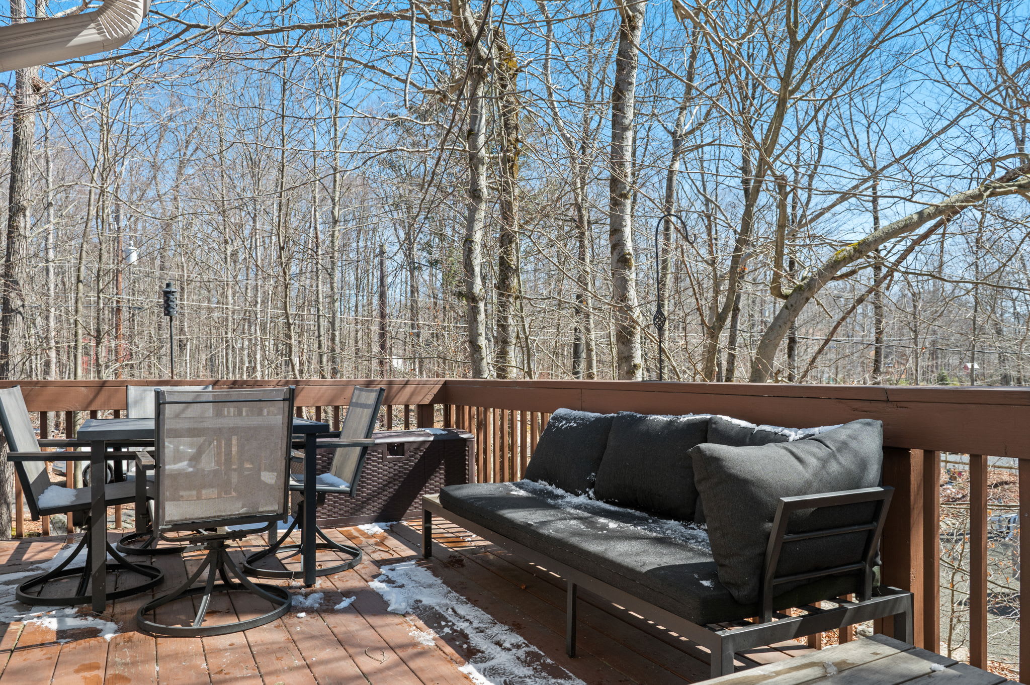 Dine al fresco or relax with a book on the cozy deck seating.