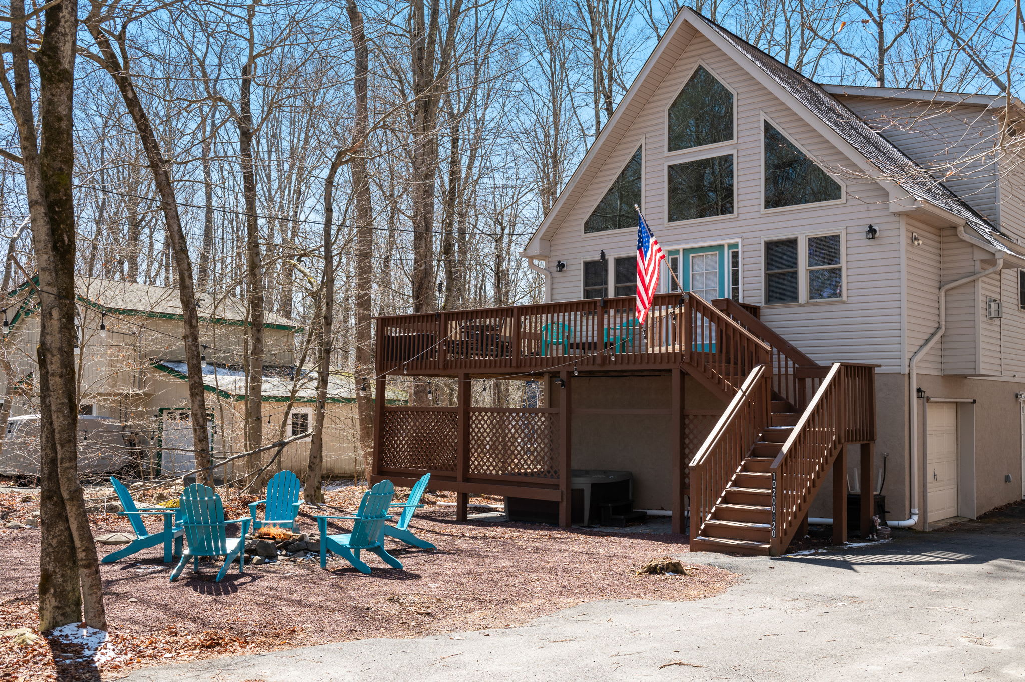 Your mountain retreat awaits with a wraparound deck and outdoor fire pit.