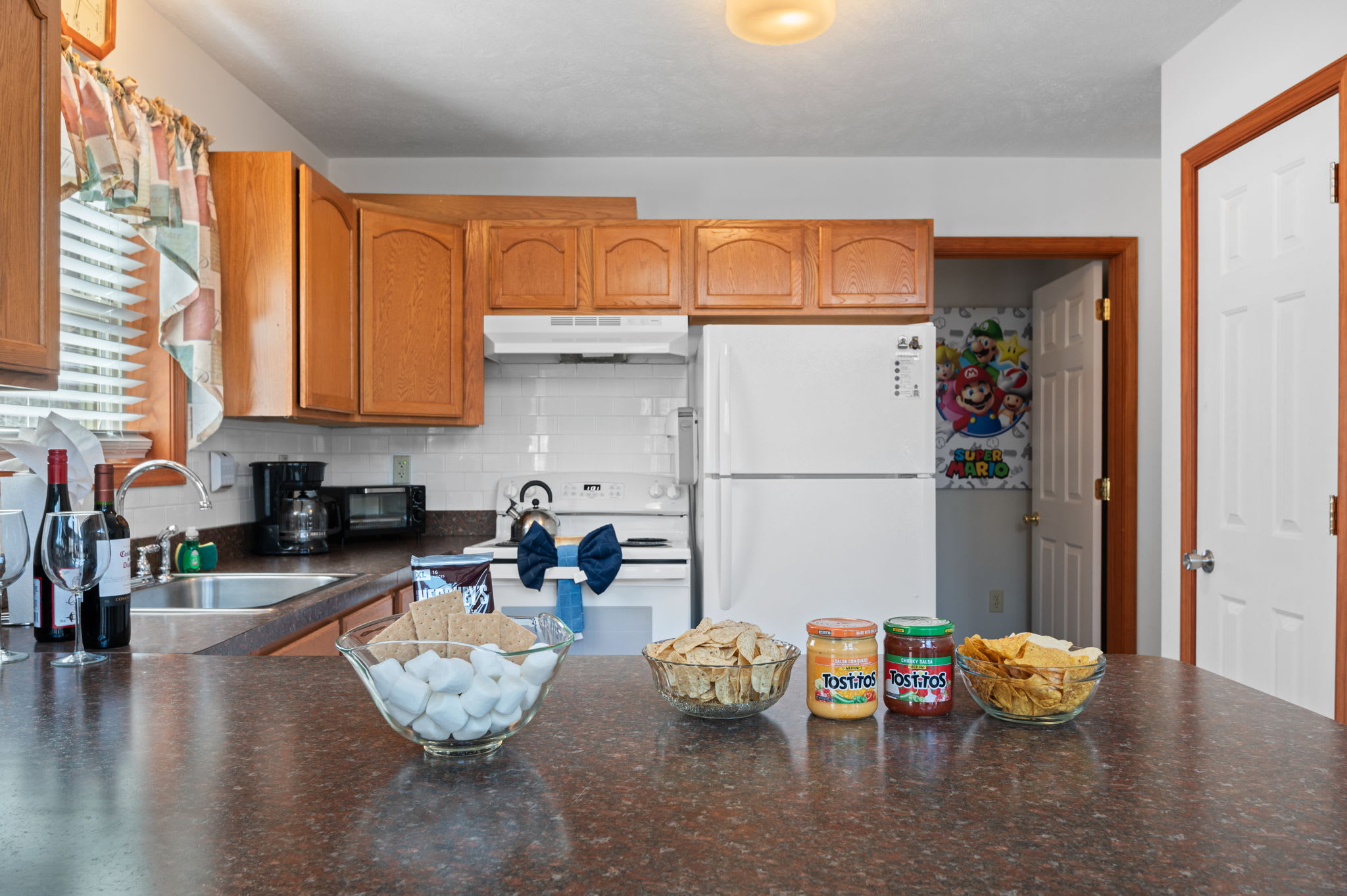 Prepare your favorite recipes in the spacious kitchen with warm wood cabinets